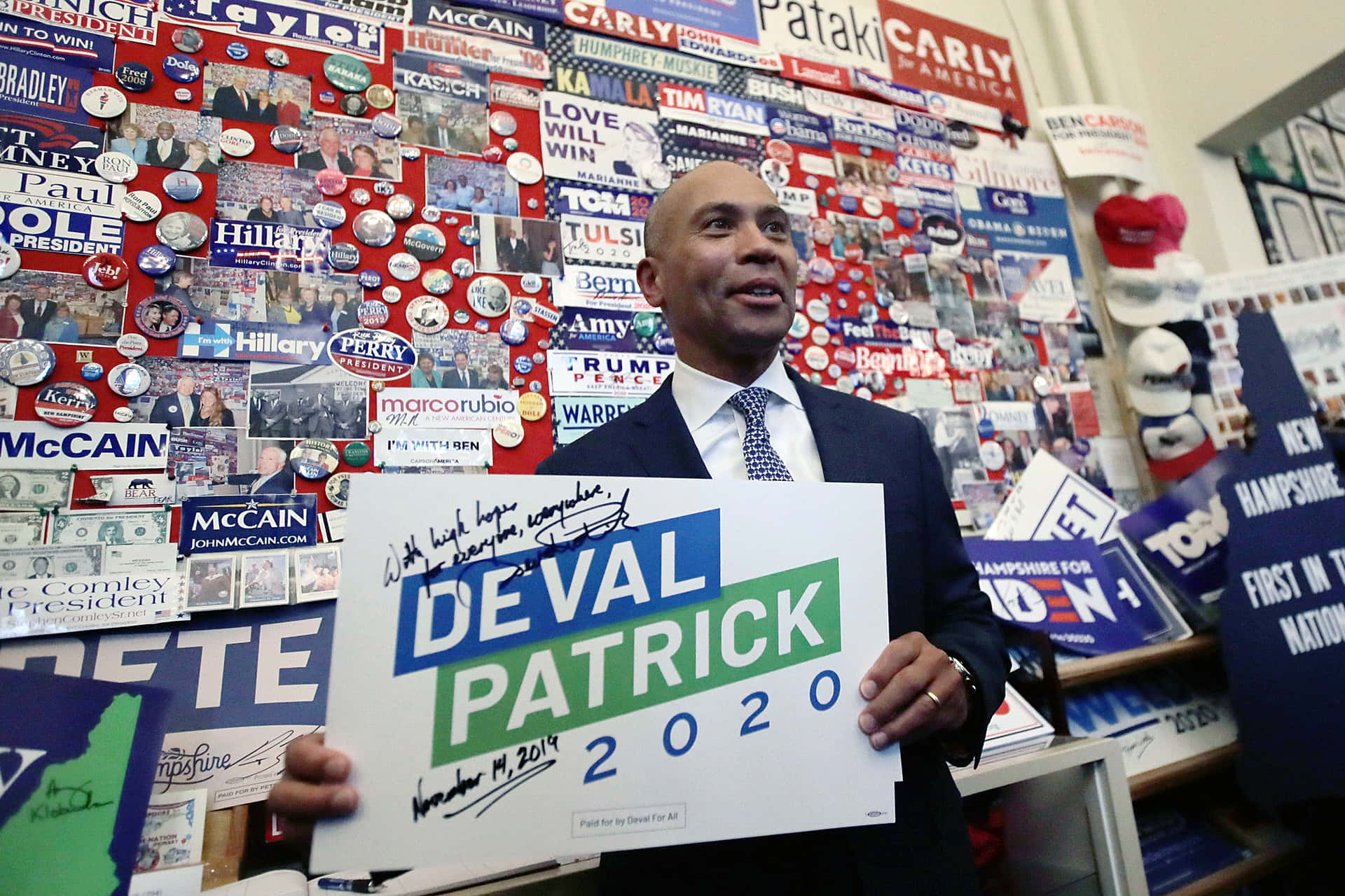 Deval Patrick Signing A Campaign Banner Background