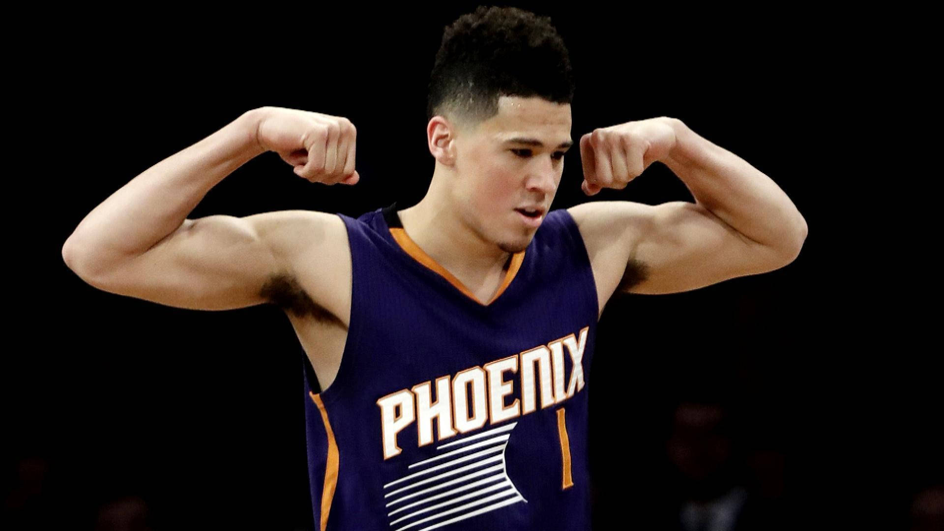 Devin Booker Flexing Muscles Background