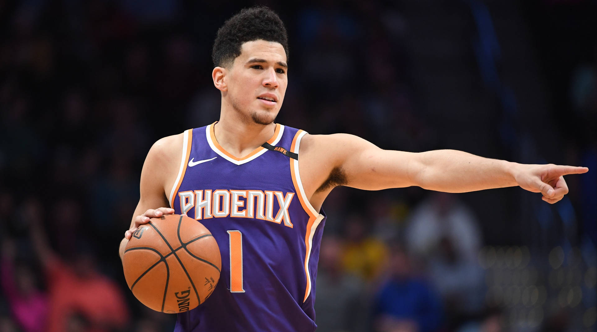 Devin Booker Pointing At Something Background