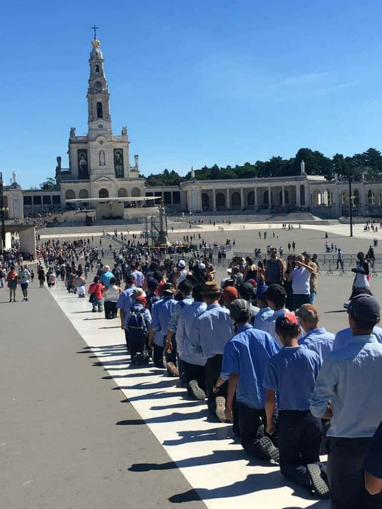 Devotees Praying At Fatima Sanctuary
