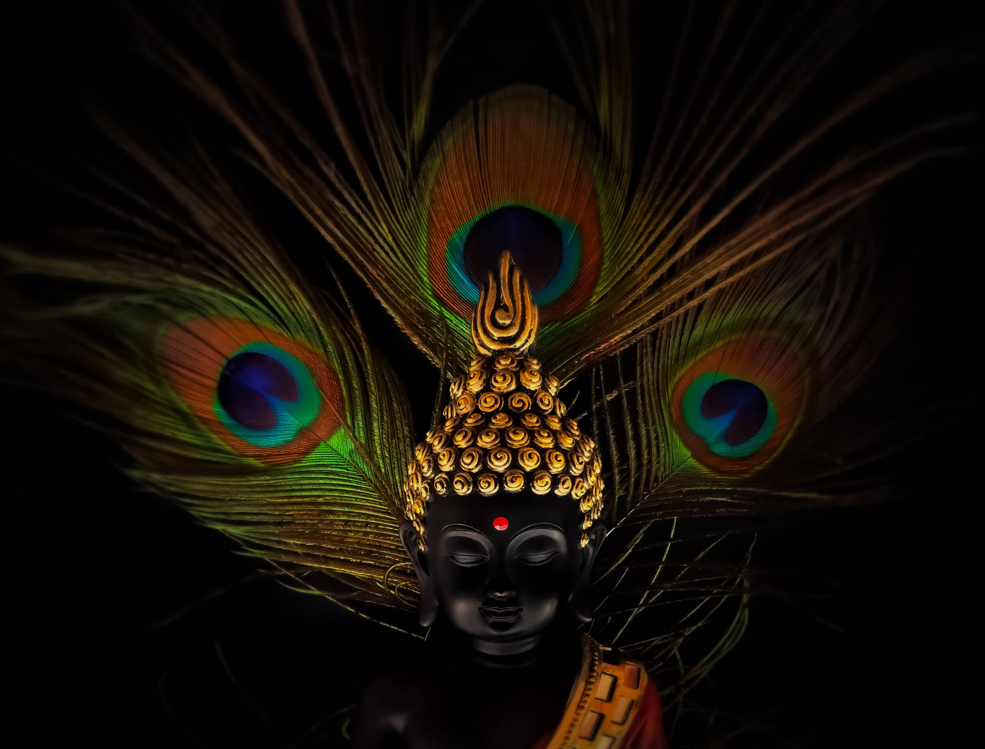 Devotion In Colors: Divine Image Of Vithu Mauli Adorned With Peacock Feathers Background
