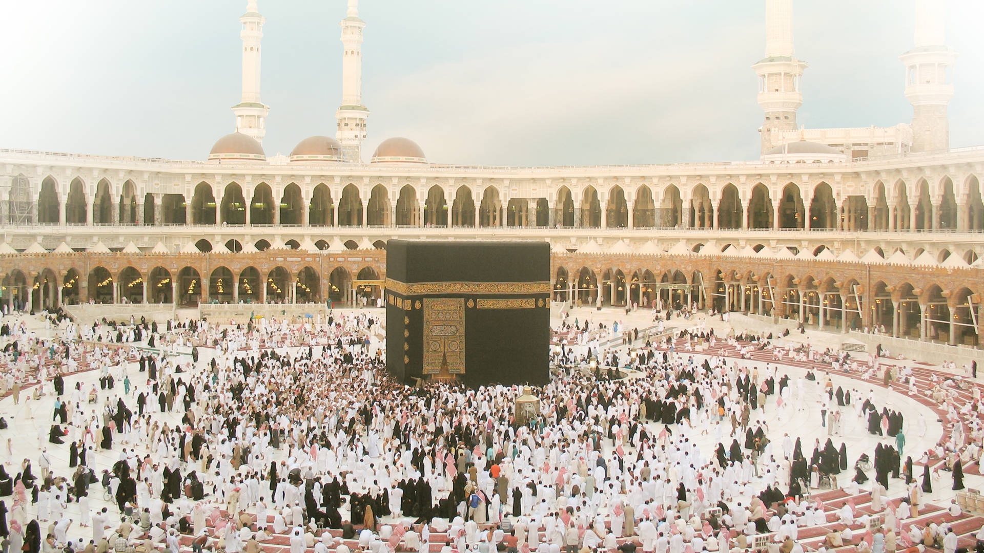 Devout Muslims Gathered Around The Sacred Kaaba Background