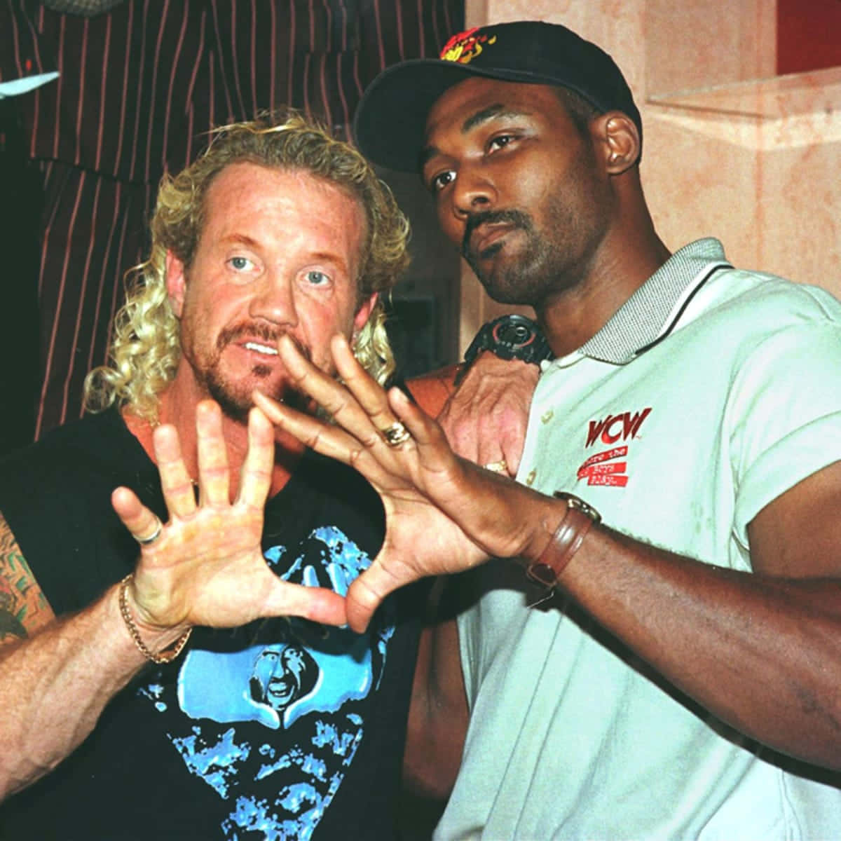 Diamond Dallas Page Hand Sign With Karl Malone Background