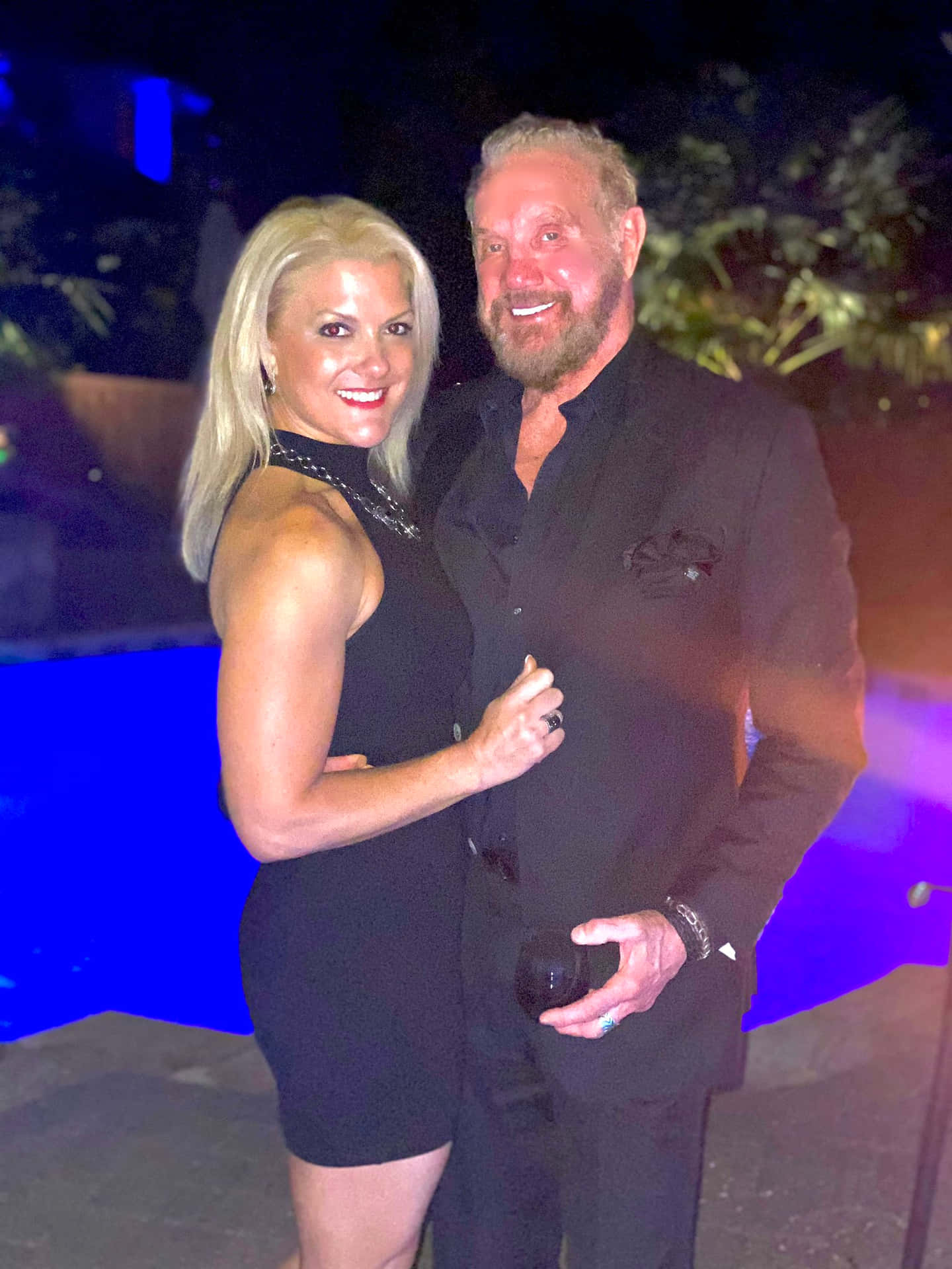 Diamond Dallas Page Posing With Payge Mcmahon. Background