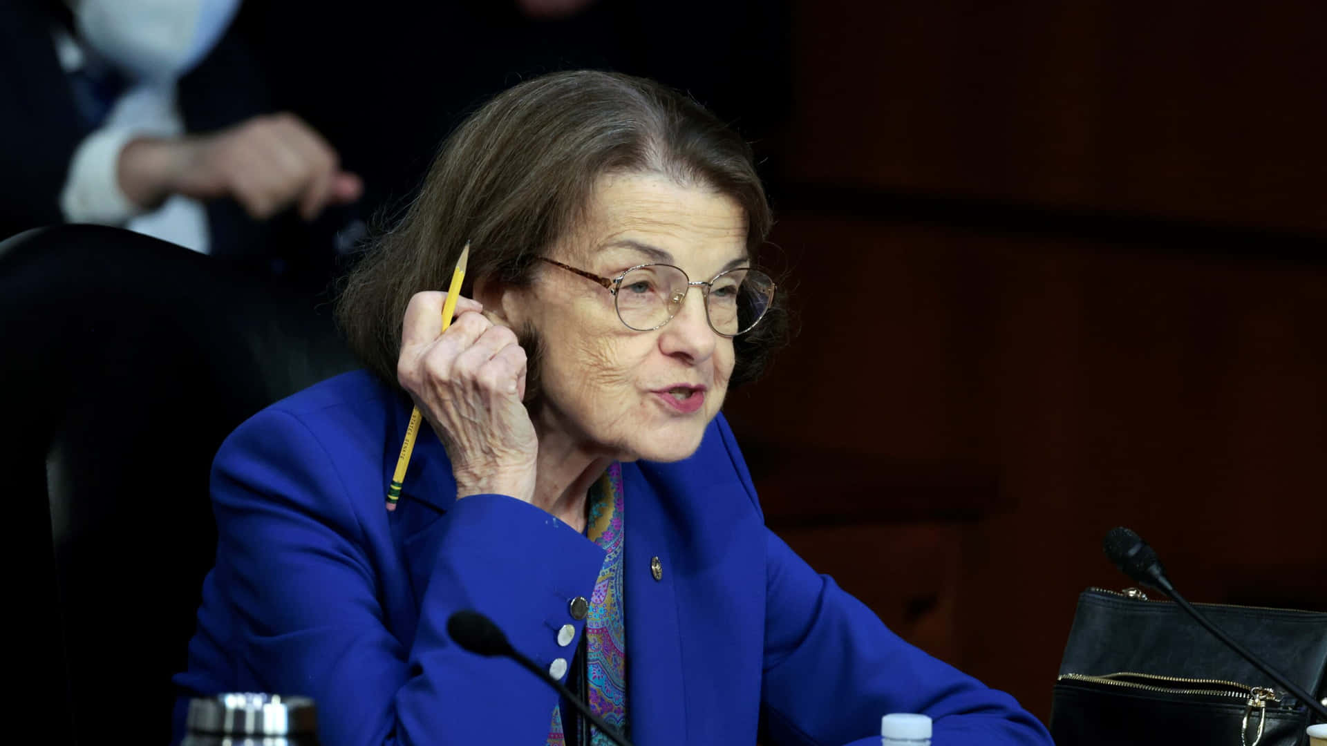 Dianne Feinstein With Pencil In Hand Background