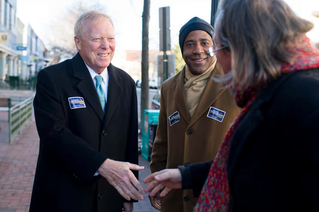 Dick Gephardt Shakes Hands With A Supporter Background