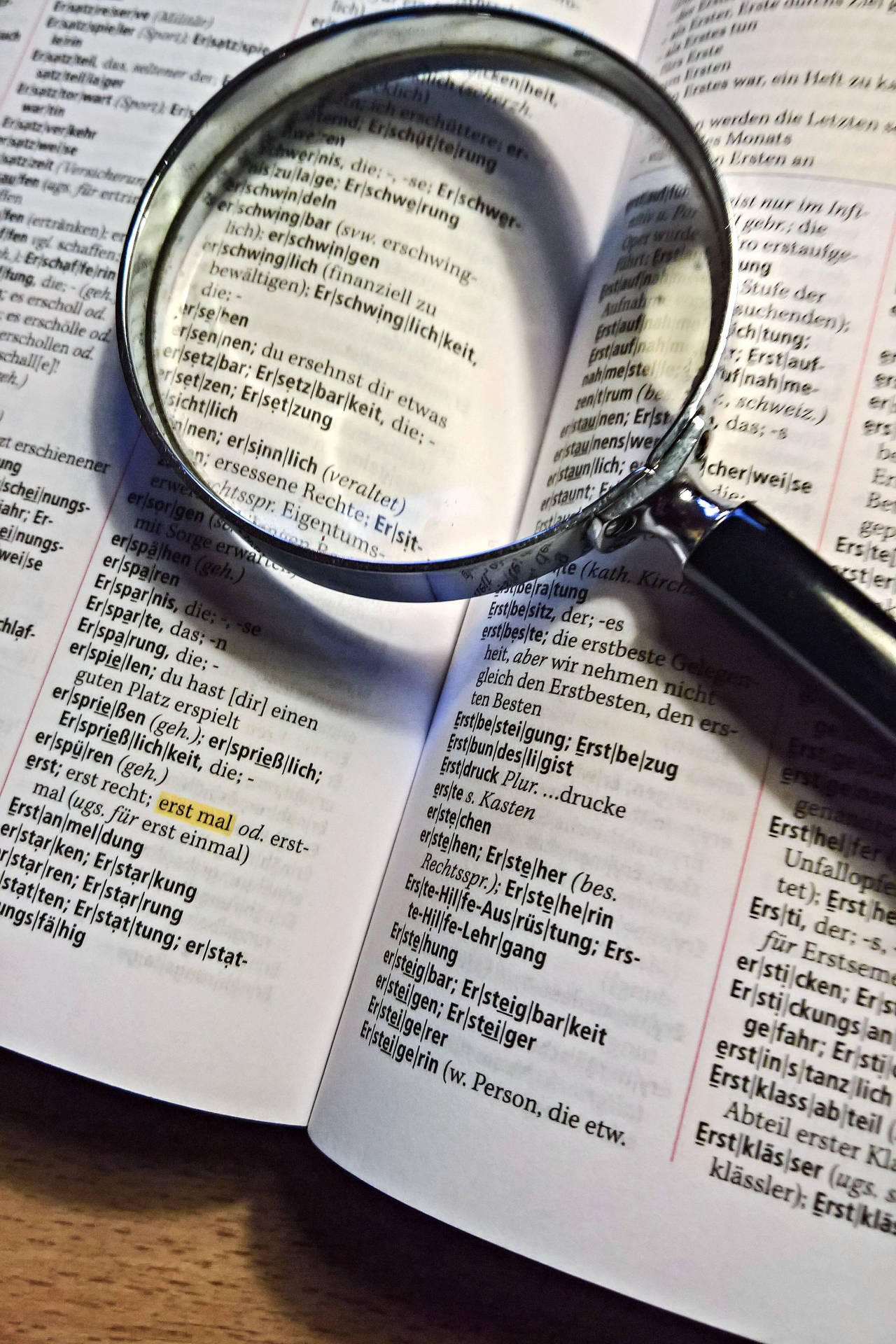Dictionary With Magnifying Glass Background