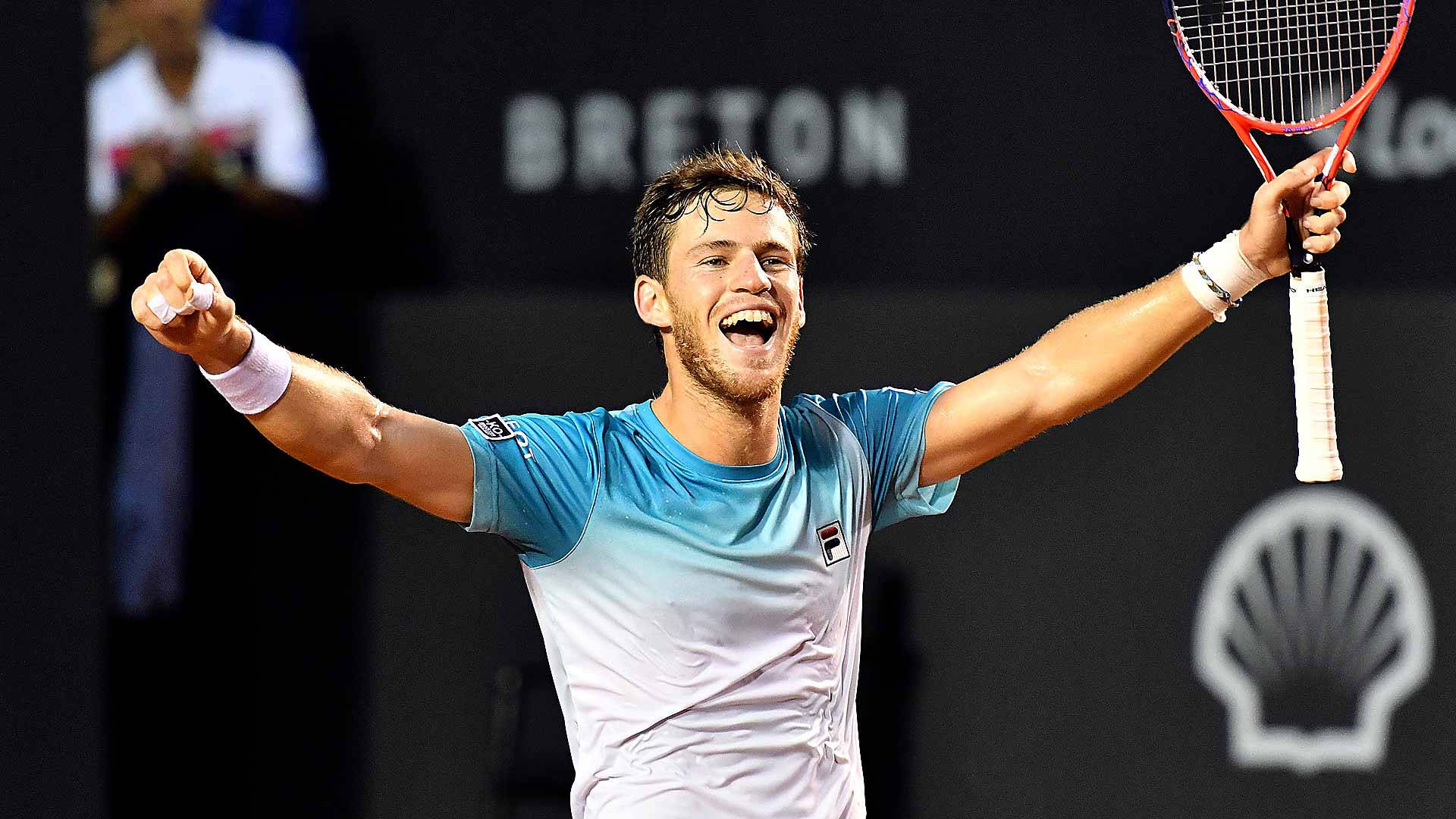 Diego Schwartzman Raising His Arms Triumphantly Background