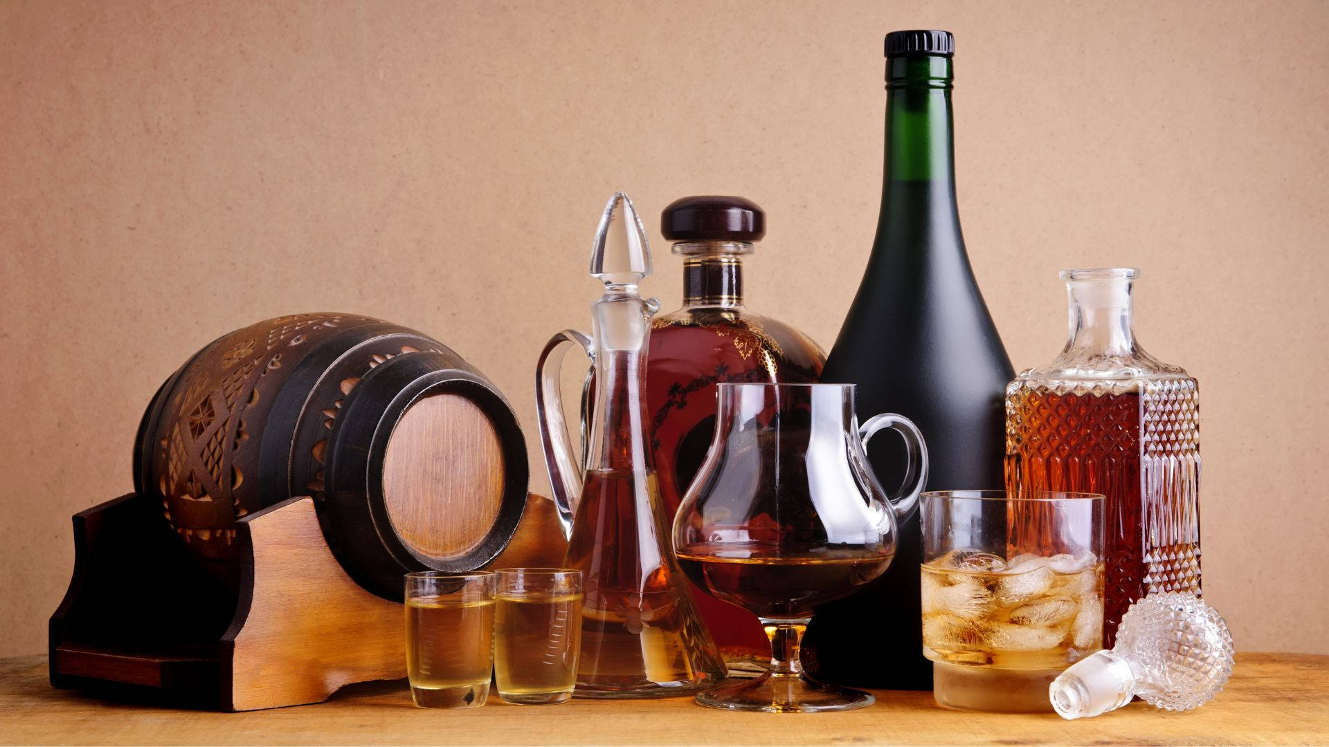 Different Drinking Alcohol With Wooden Barrel Background