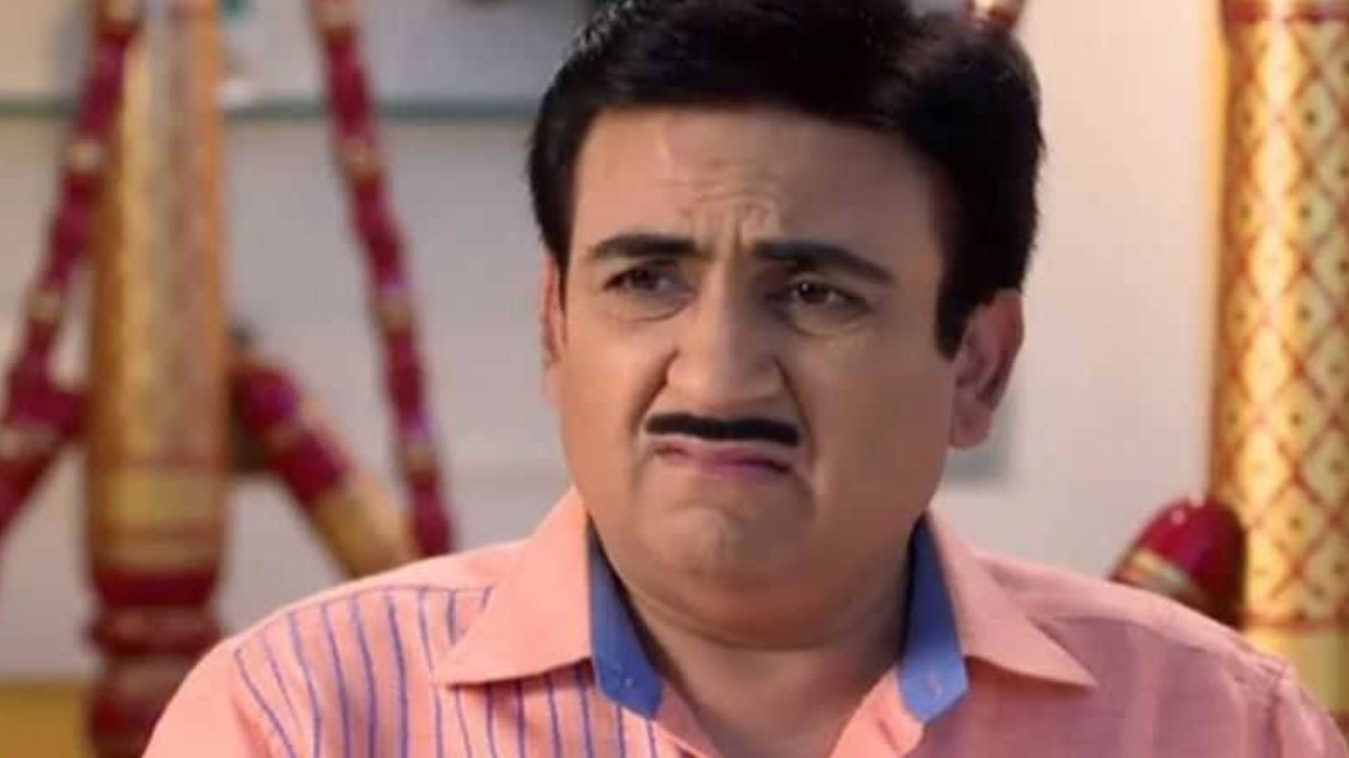 Dilip Joshi Portraying The Vibrant Character Jethalal In A Pink Polo Background