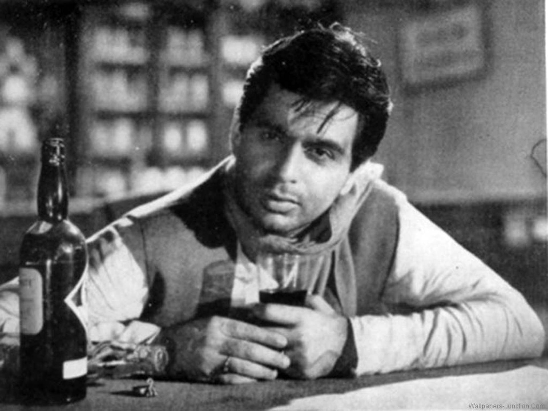 Dilip Kumar With A Drink Background