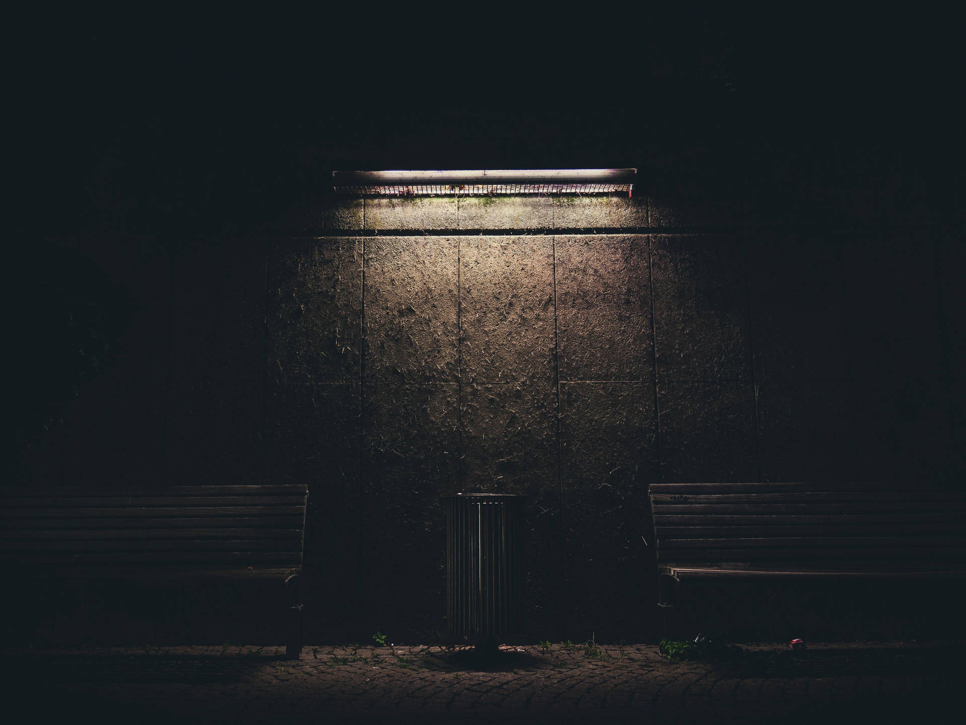 Dim Light Casts A Gentle Glow Over A Brown Painted Wall Background