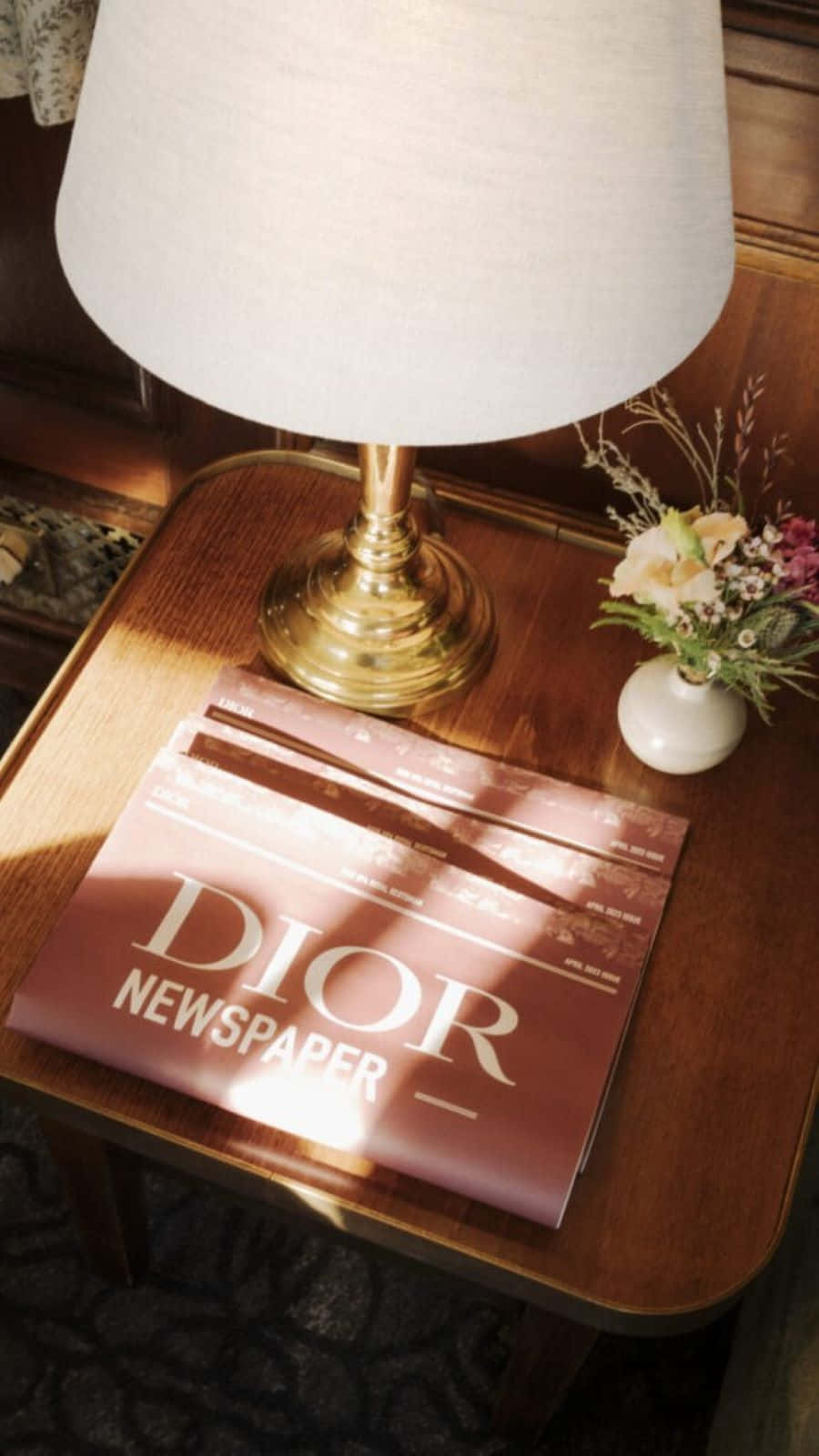 Dior Newspaperon Wooden Table