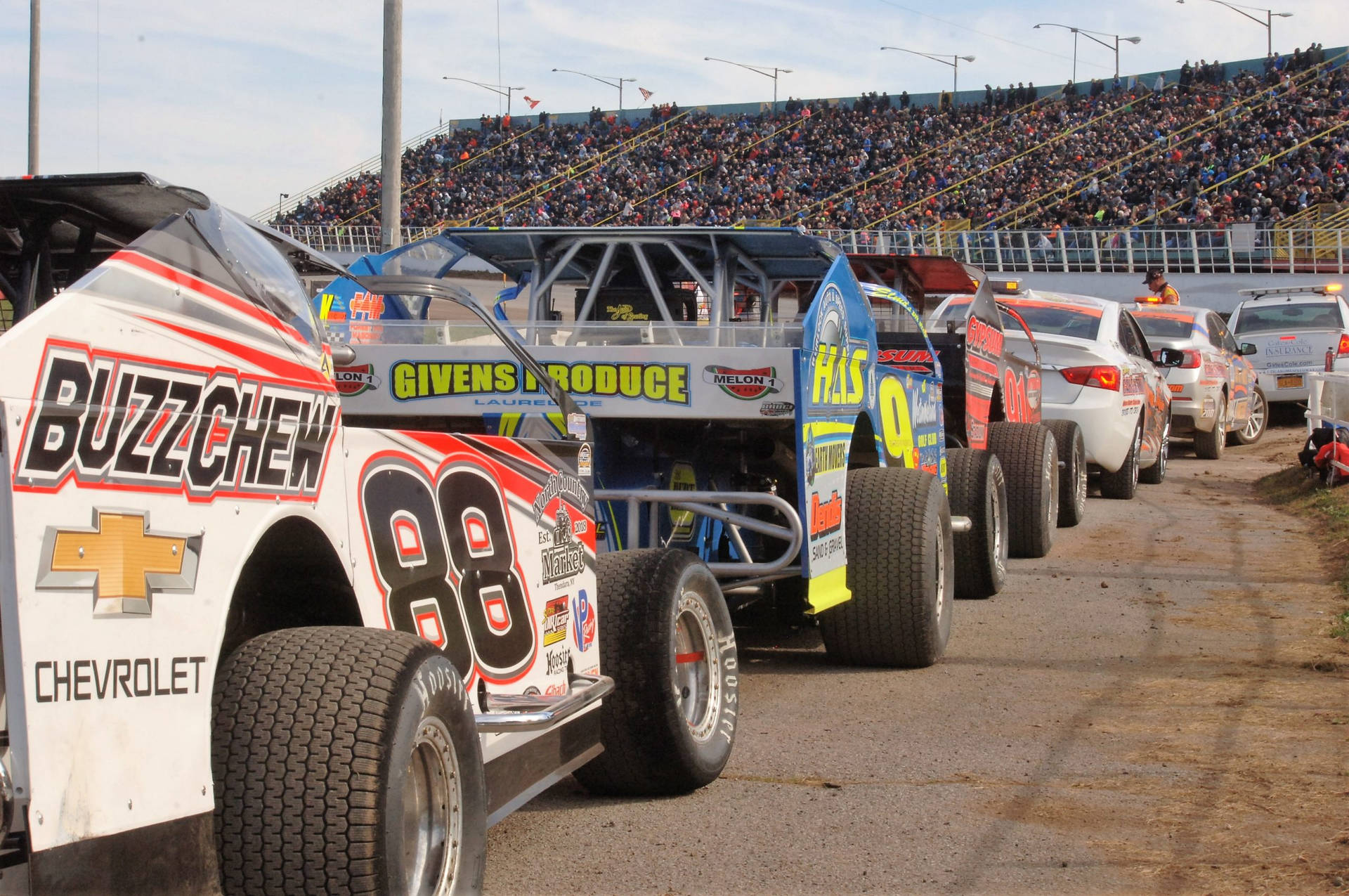 Dirt Car Lined Up On Track Background