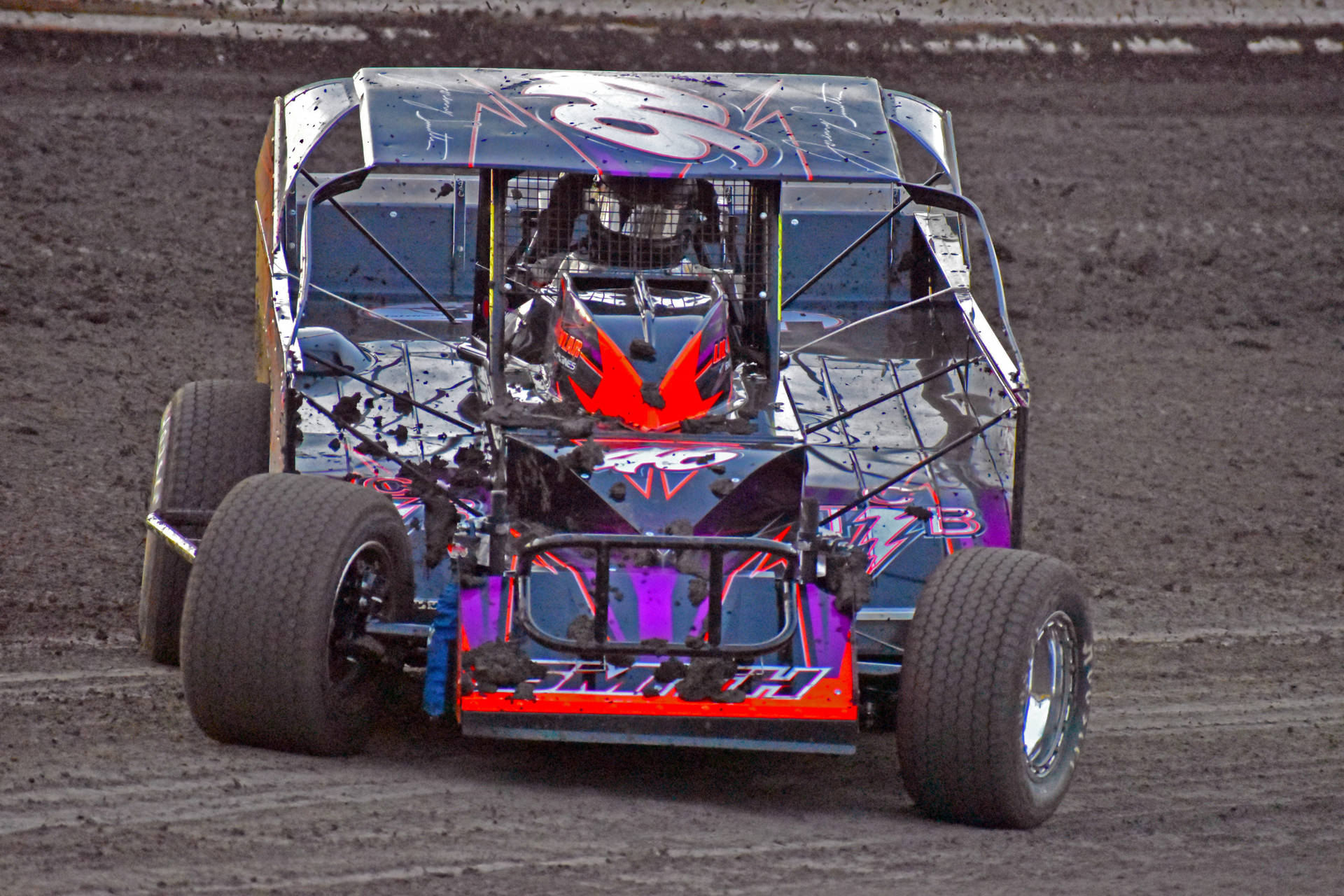 Dirt Car With Red And Violet Decals Background