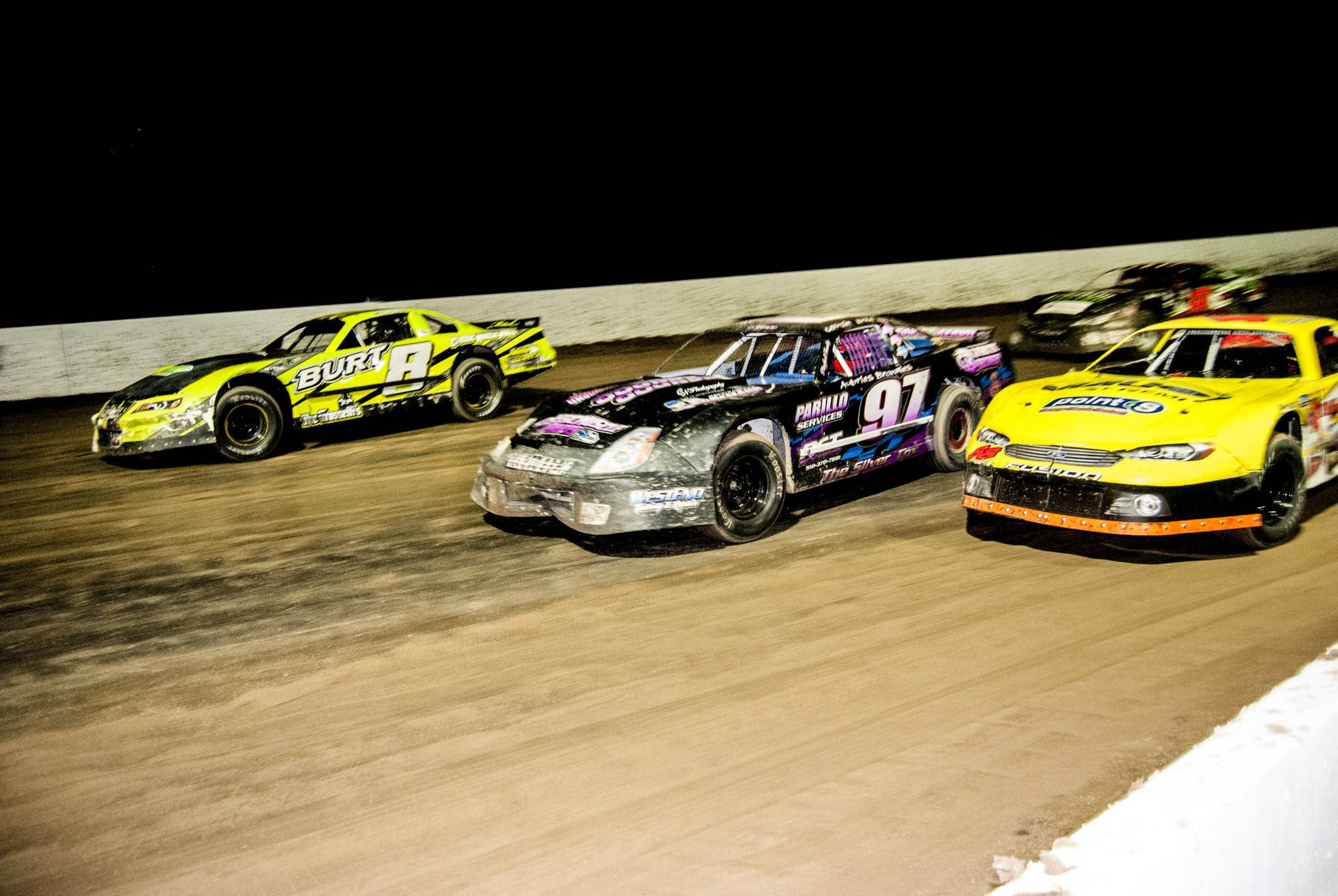 Dirt Racing Cars On A Dirt Track Background