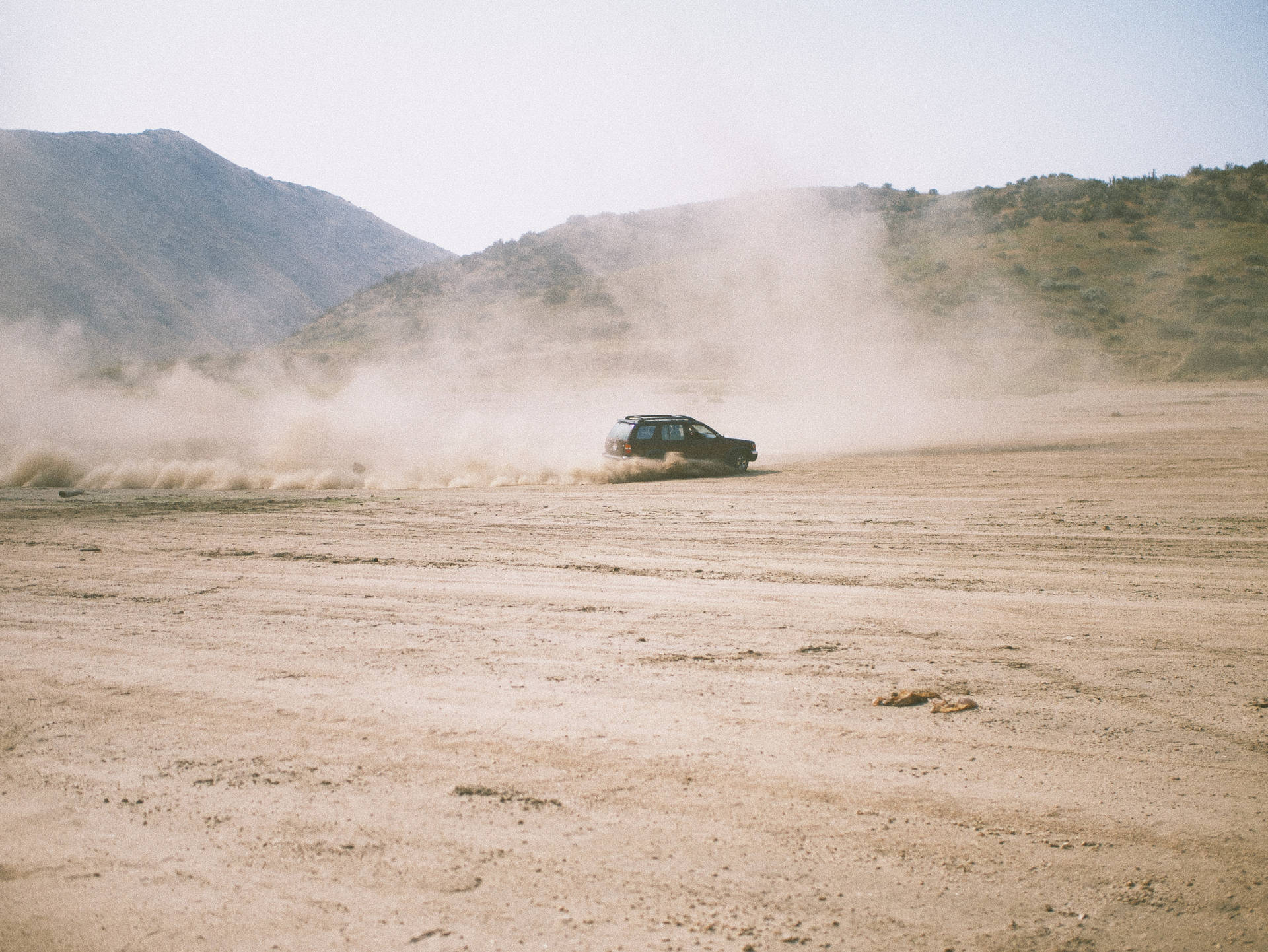 Dirt Rally Car In Desert Route Background