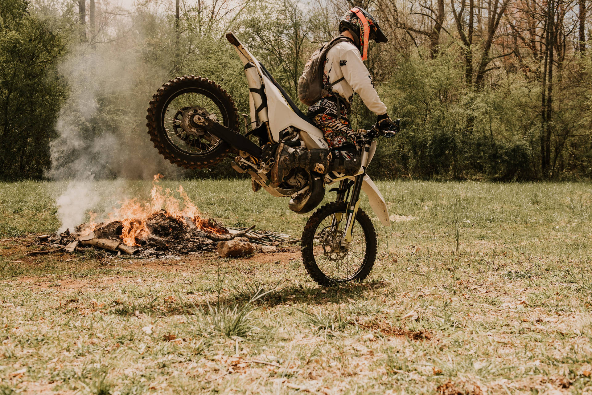 Dirtbike By Campfire Background
