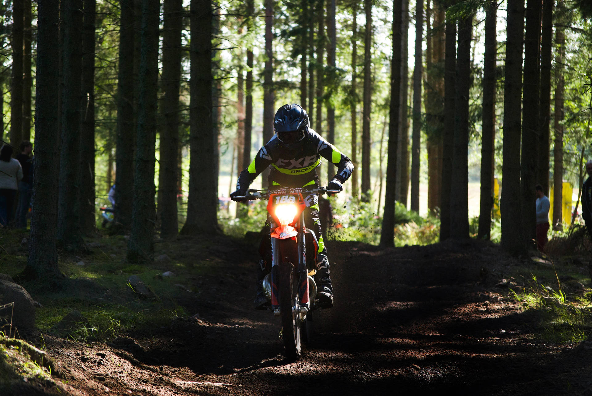 Dirtbike Through Forest Background