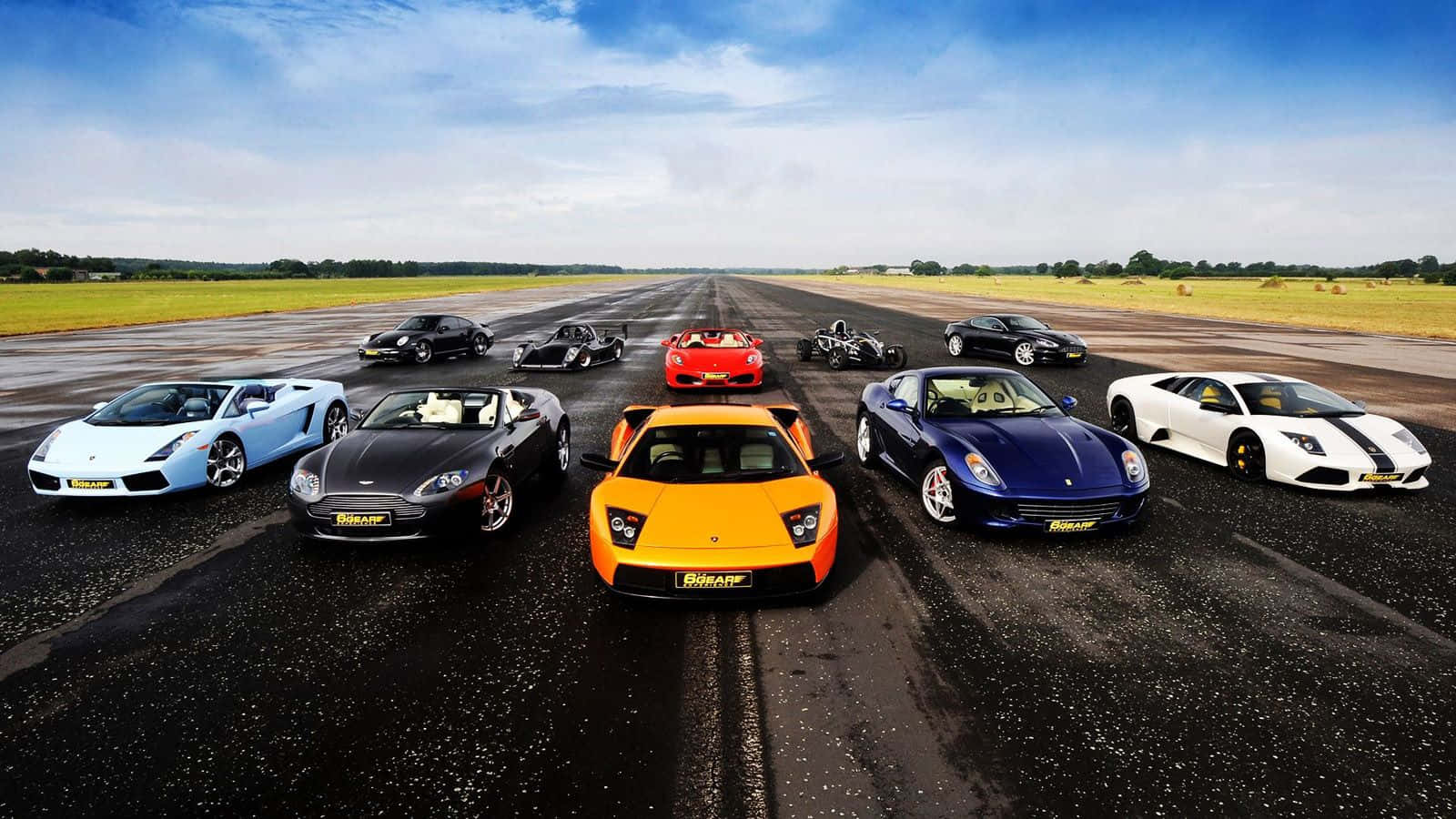 Display Of Top 10 Luxury Cars Of The Year Background