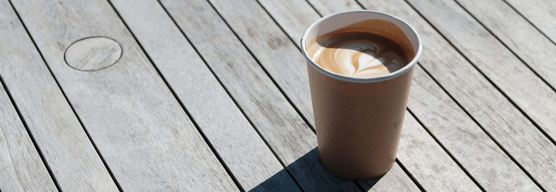 Disposable Cup With Coffee Background