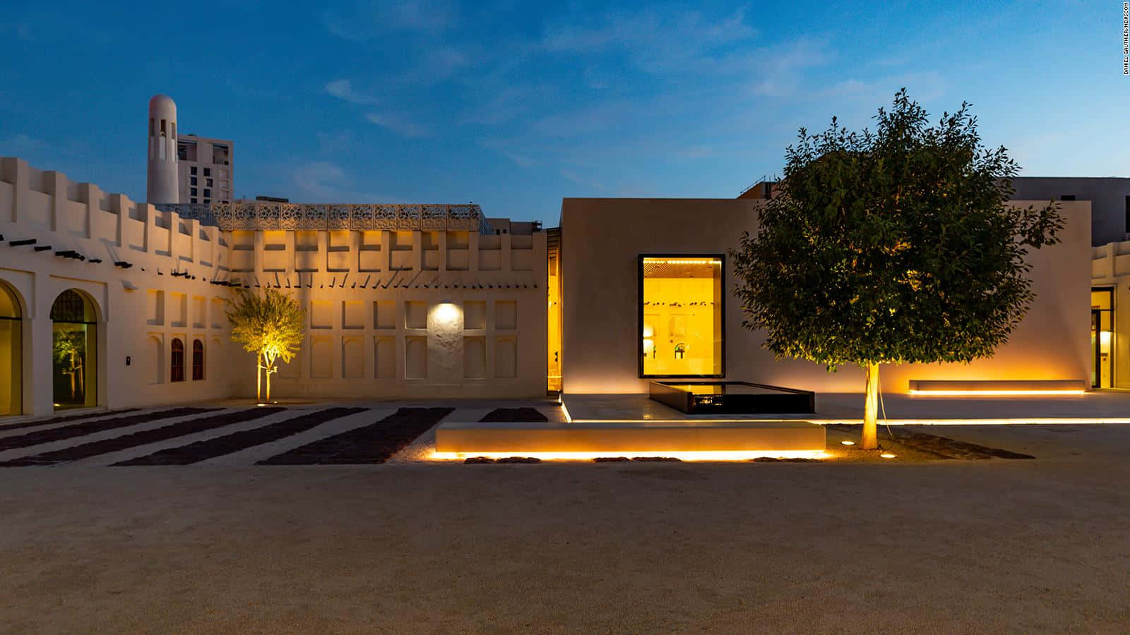Distinctive Architecture Of The Museum Of Islamic Art Against A Vivid Sunset Background