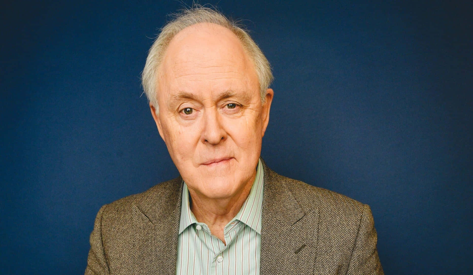 Distinguished Actor John Lithgow In A Portrait Shot Background