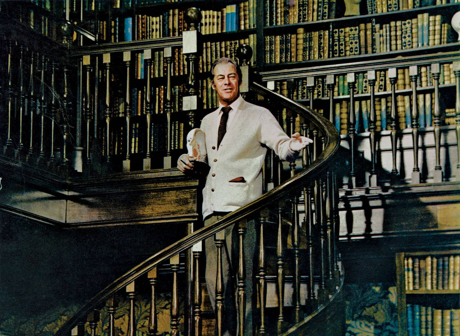 Distinguished Actor Rex Harrison Walking Down The Grand Library Stairs. Background