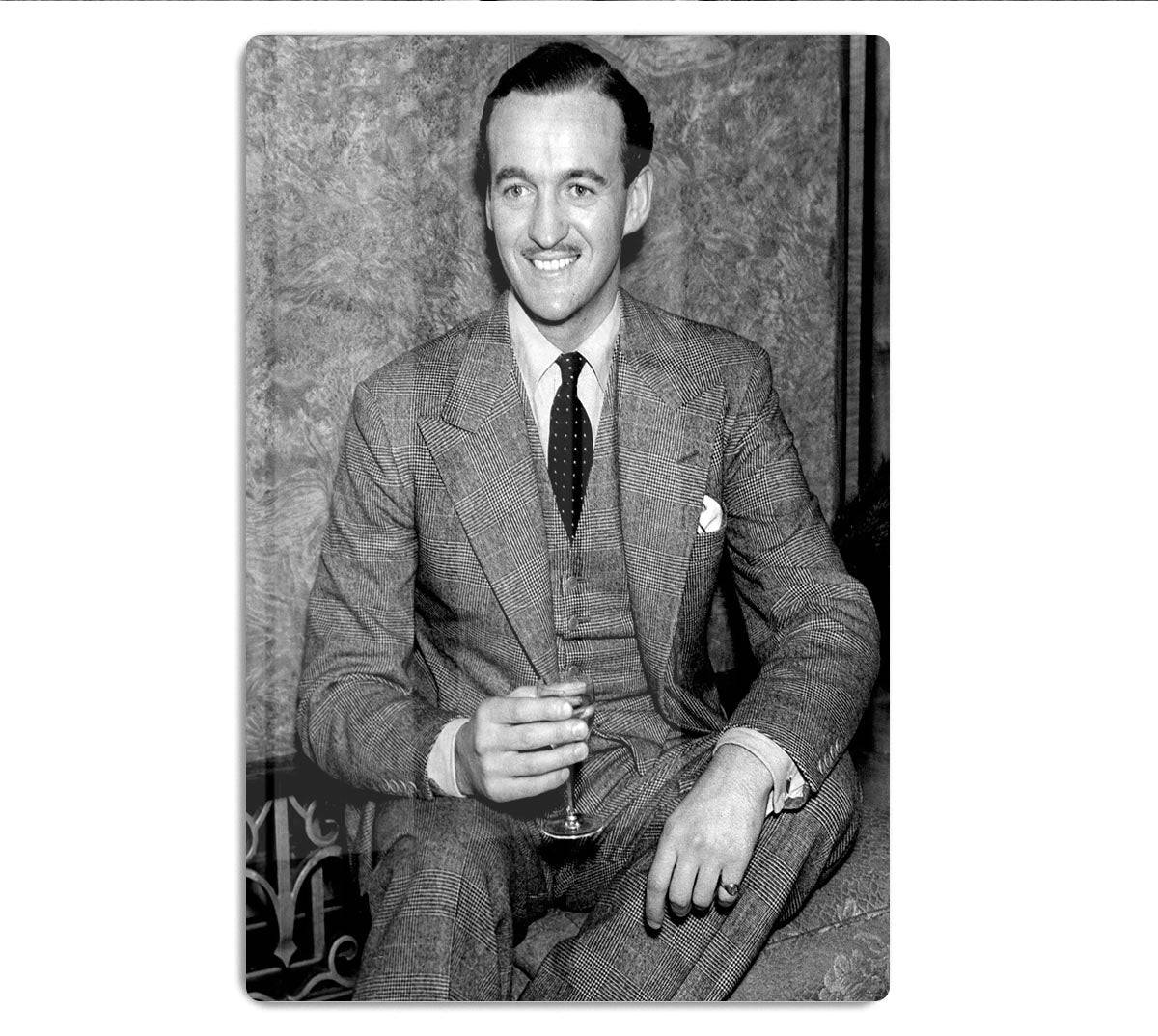 Distinguished British Actor David Niven Enjoying A Glass Of Wine Background