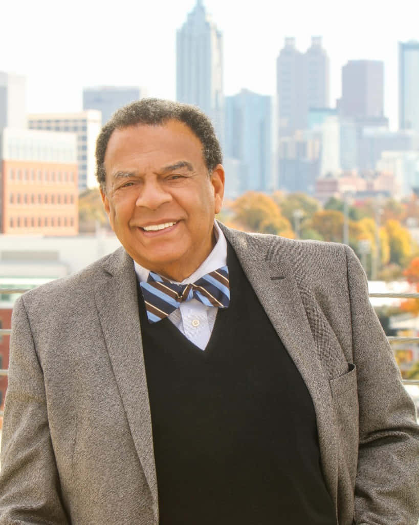 Distinguished Portrait Of Andrew Young Donning A Multicolored Bowtie Background