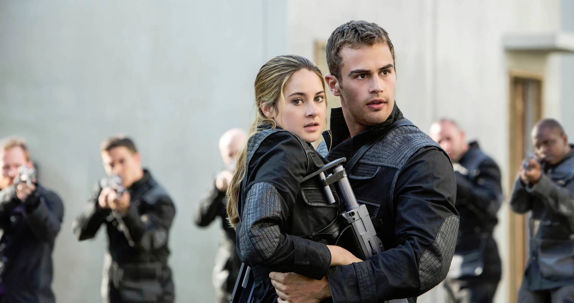 Divergent Four And Tris Against Soldiers Background