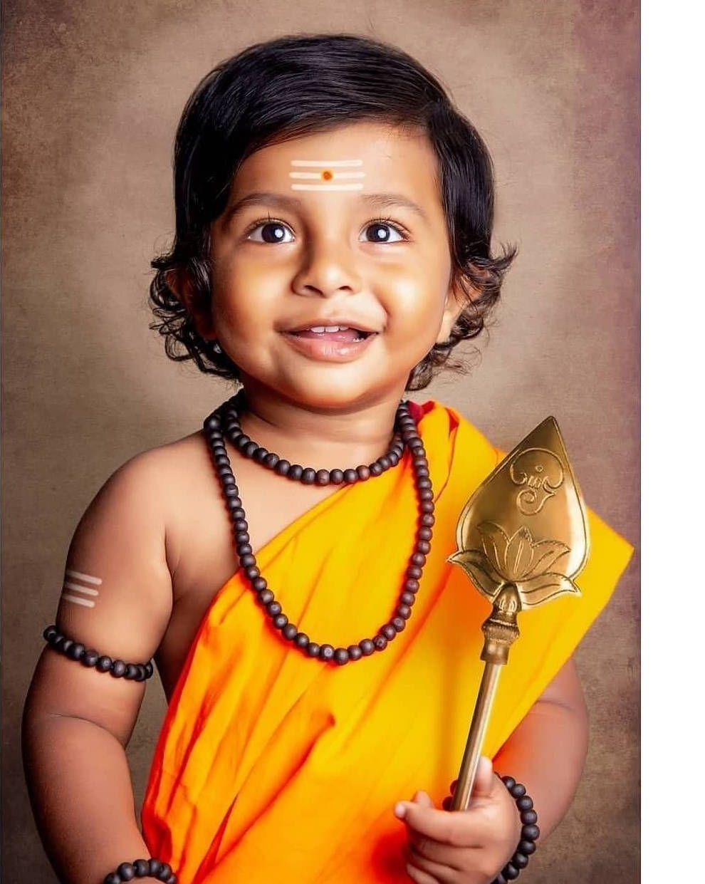 Divine Baby Murugan Clothed In Radiance And Golden Veera Vel Background