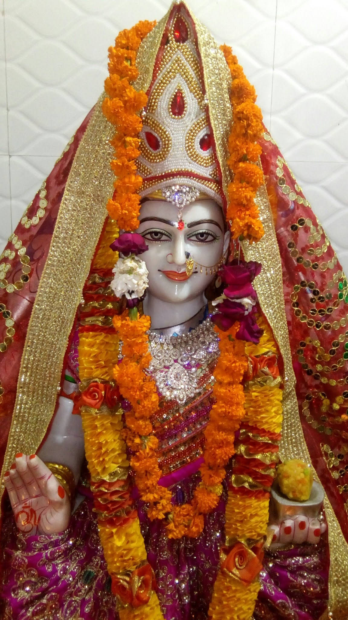 Divine Blessings - Santoshi Maa With Floral Offerings
