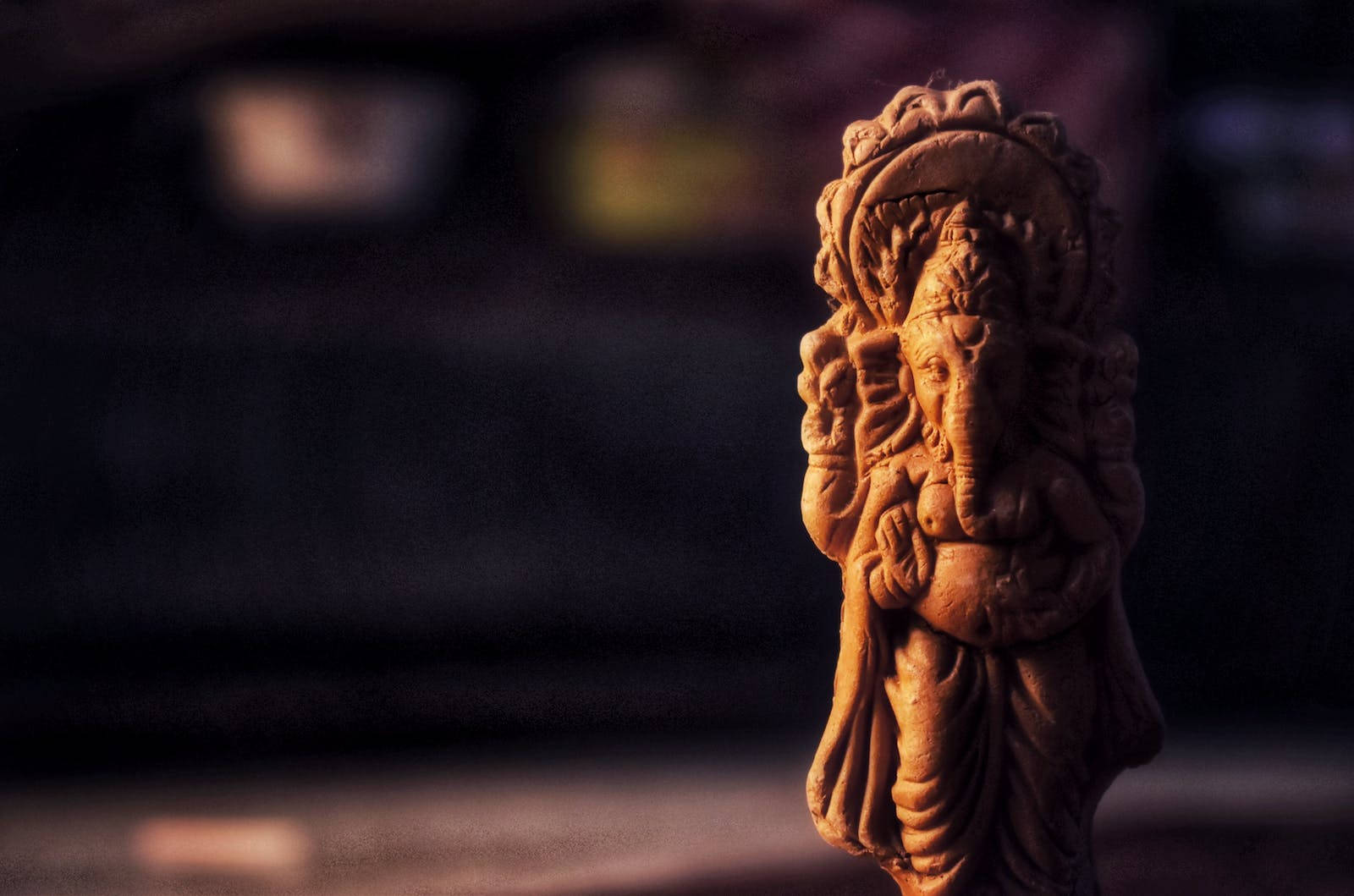 Divine Clay Sculpture Of God Ganesh Background