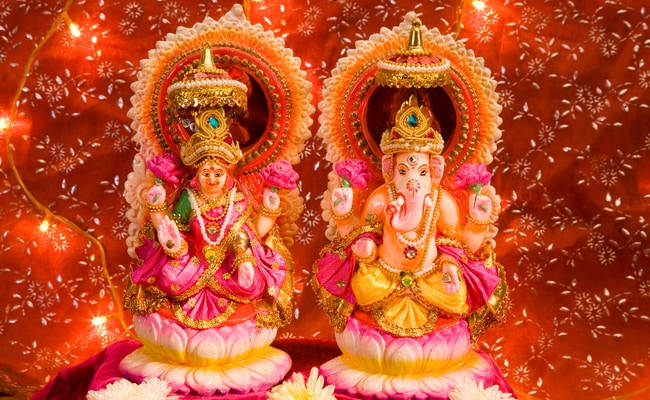 Divine Figurines Of Ganesh And Lakshmi
