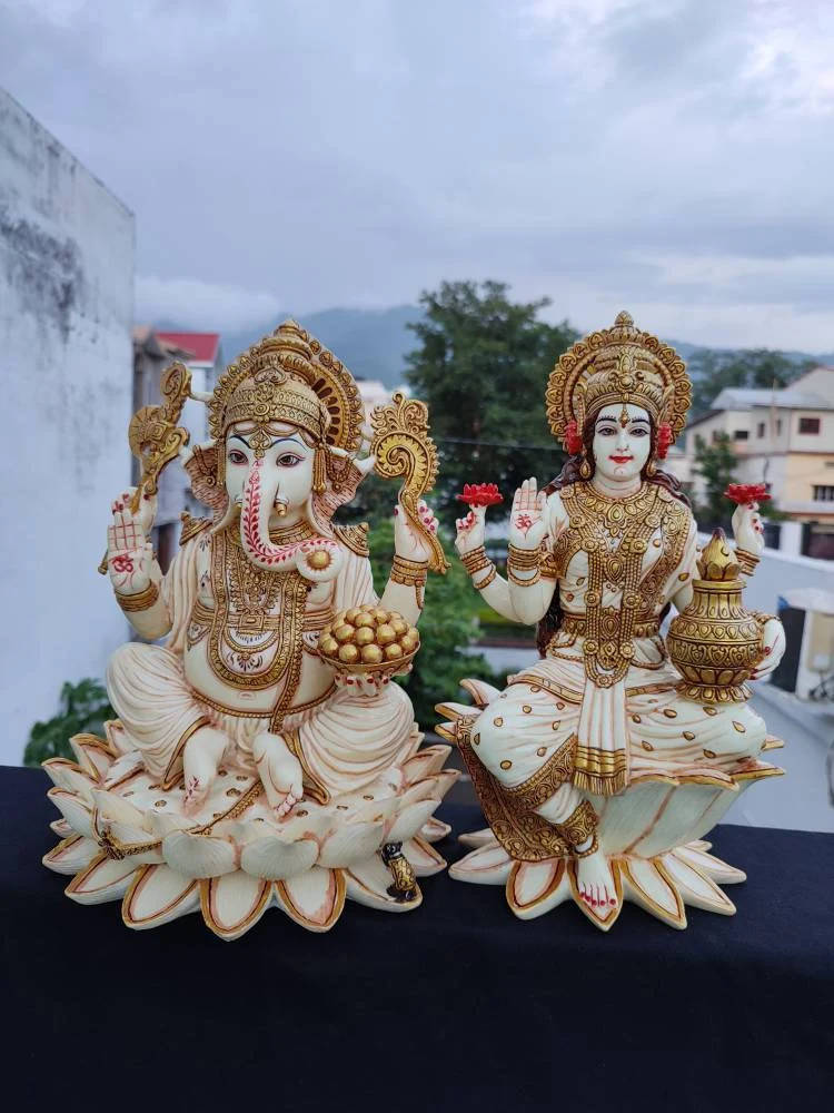 Divine Ganesh Lakshmi Idol On Diwali Celebration Altar Background