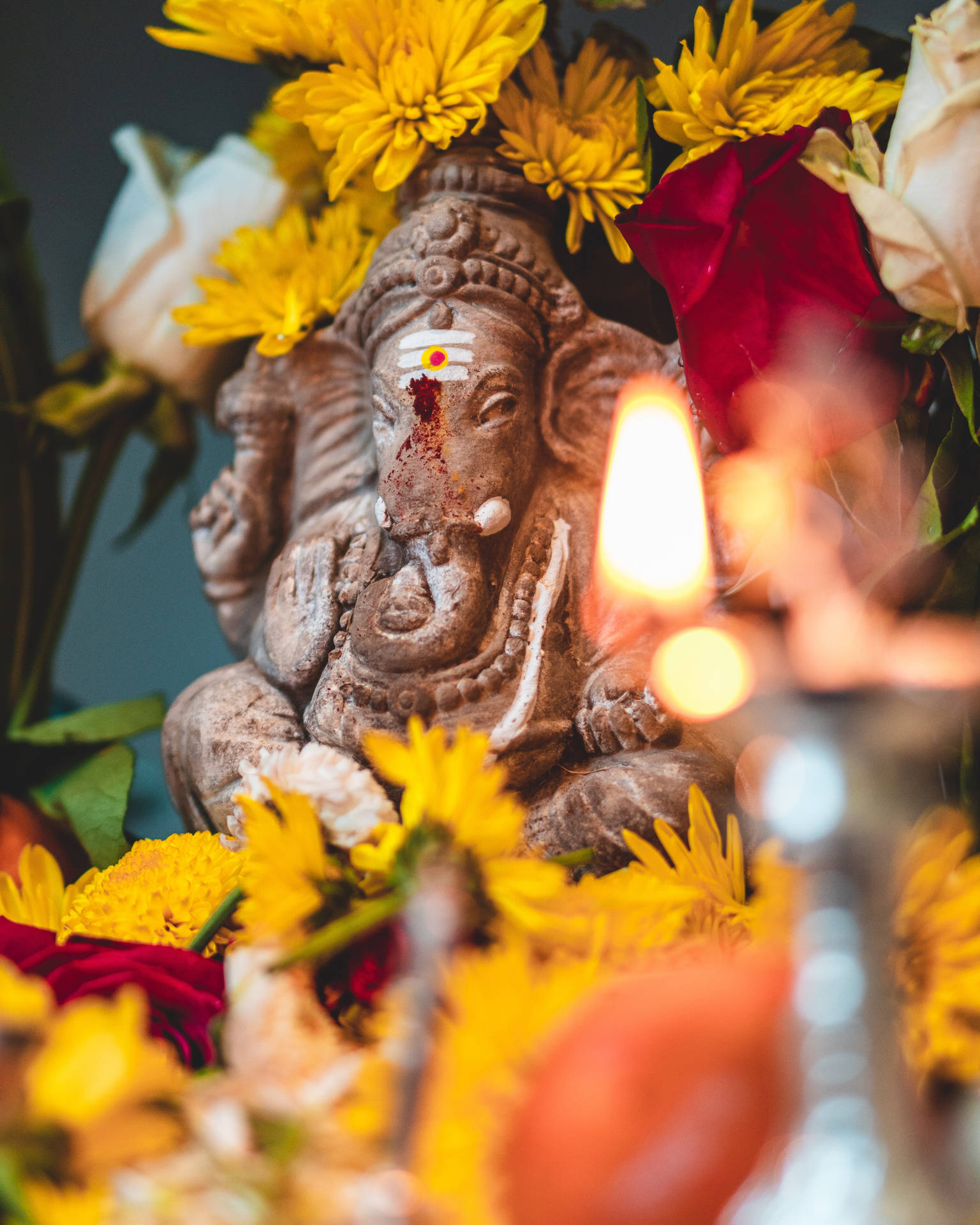 Divine Stone Sculpture Of Lord Ganesh Background