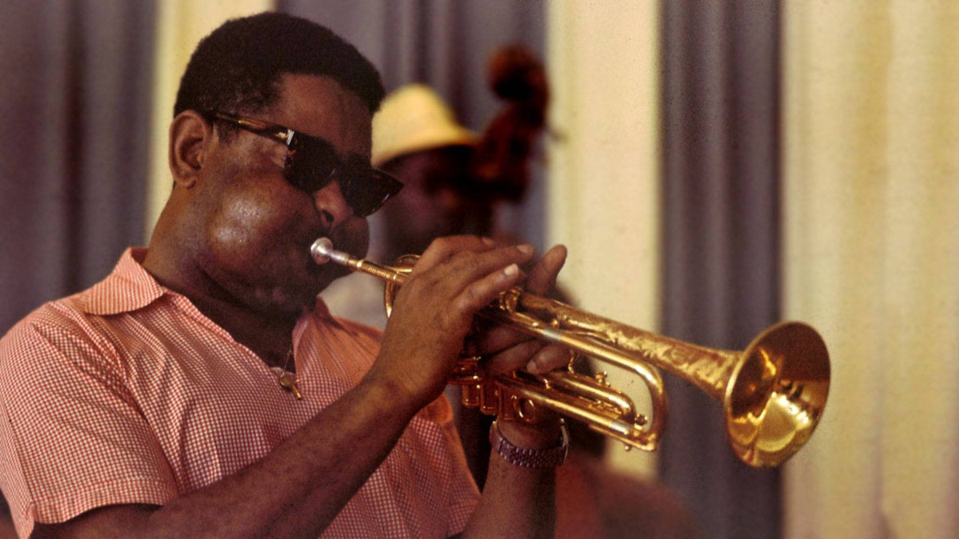 Dizzy Gillespie Presenting An Intricate Jazz Solo On His Trumpet Background