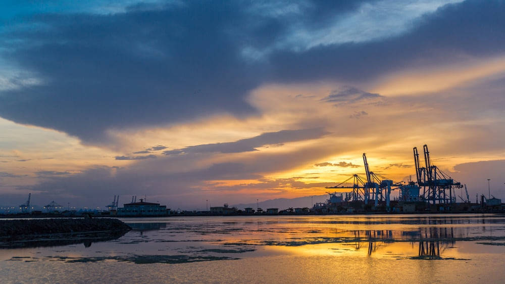 Djibouti Port At Sunset Background