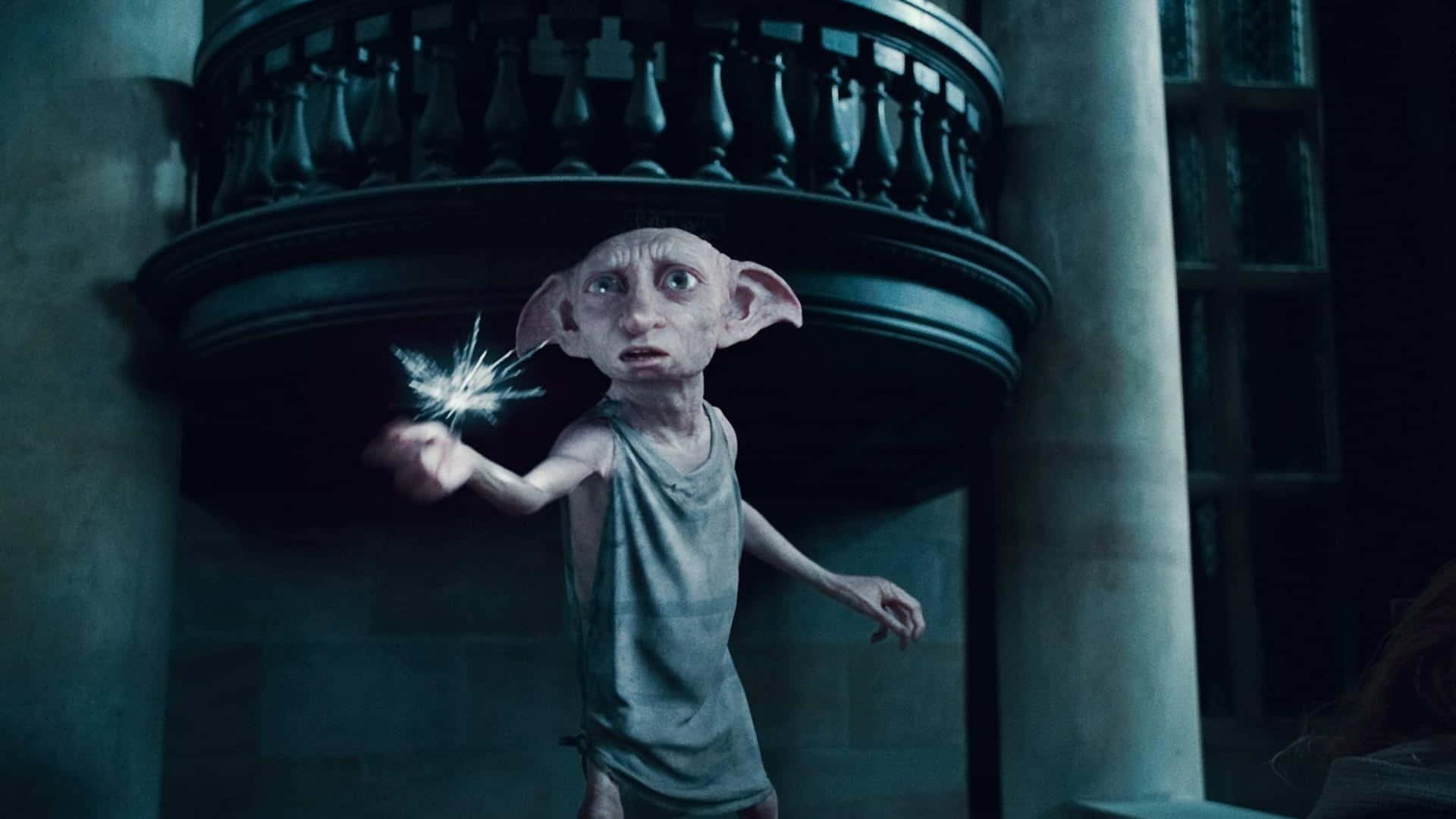 Dobby The House Elf Joyously Celebrates With Harry Potter Background