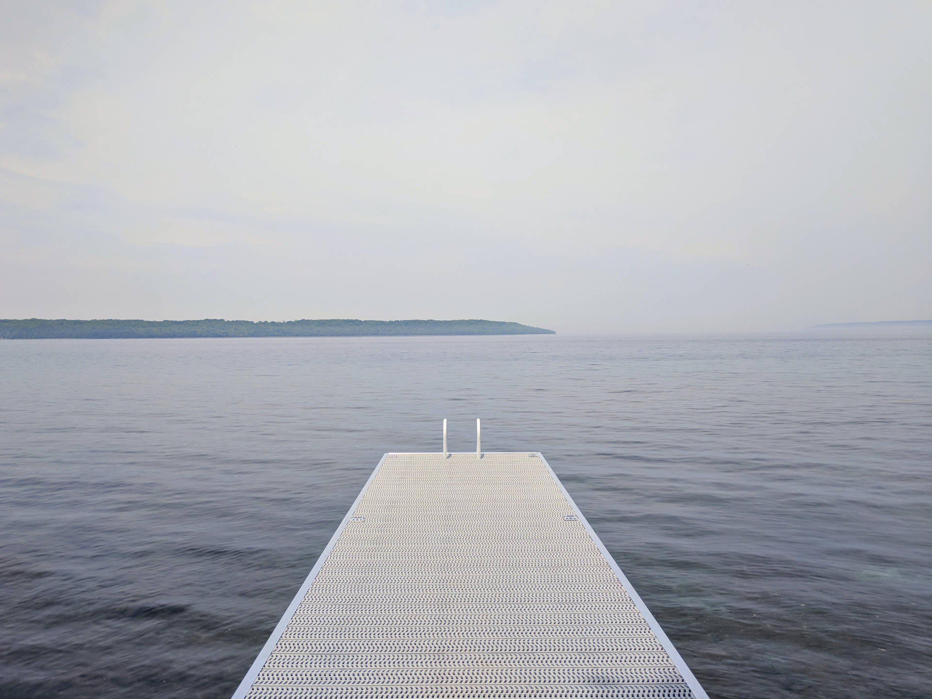 Dock At A Calming Lake Scenery Background