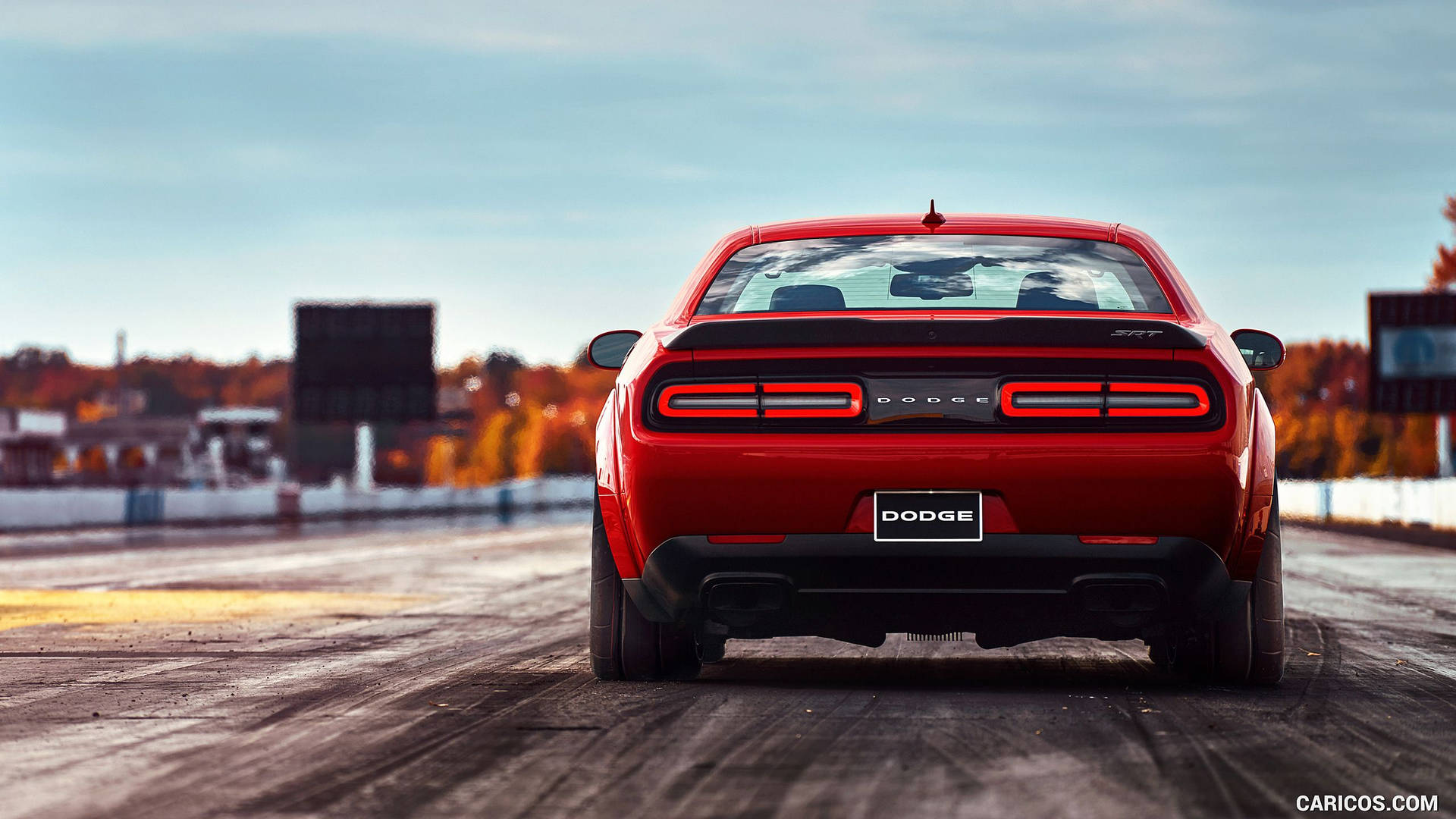 Dodge Challenger In Racing Track Background
