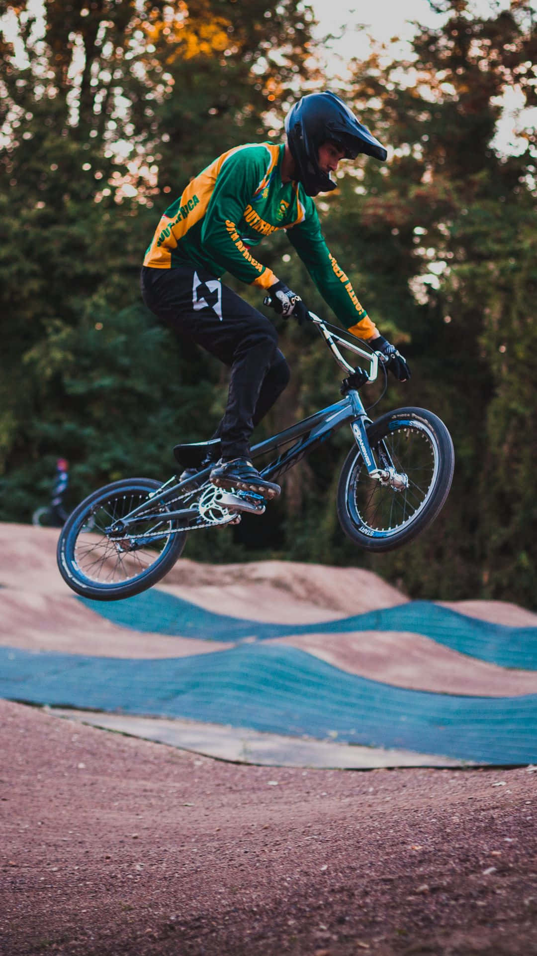 Doing A Tailwhip On A Bmx In The Great Outdoors Background