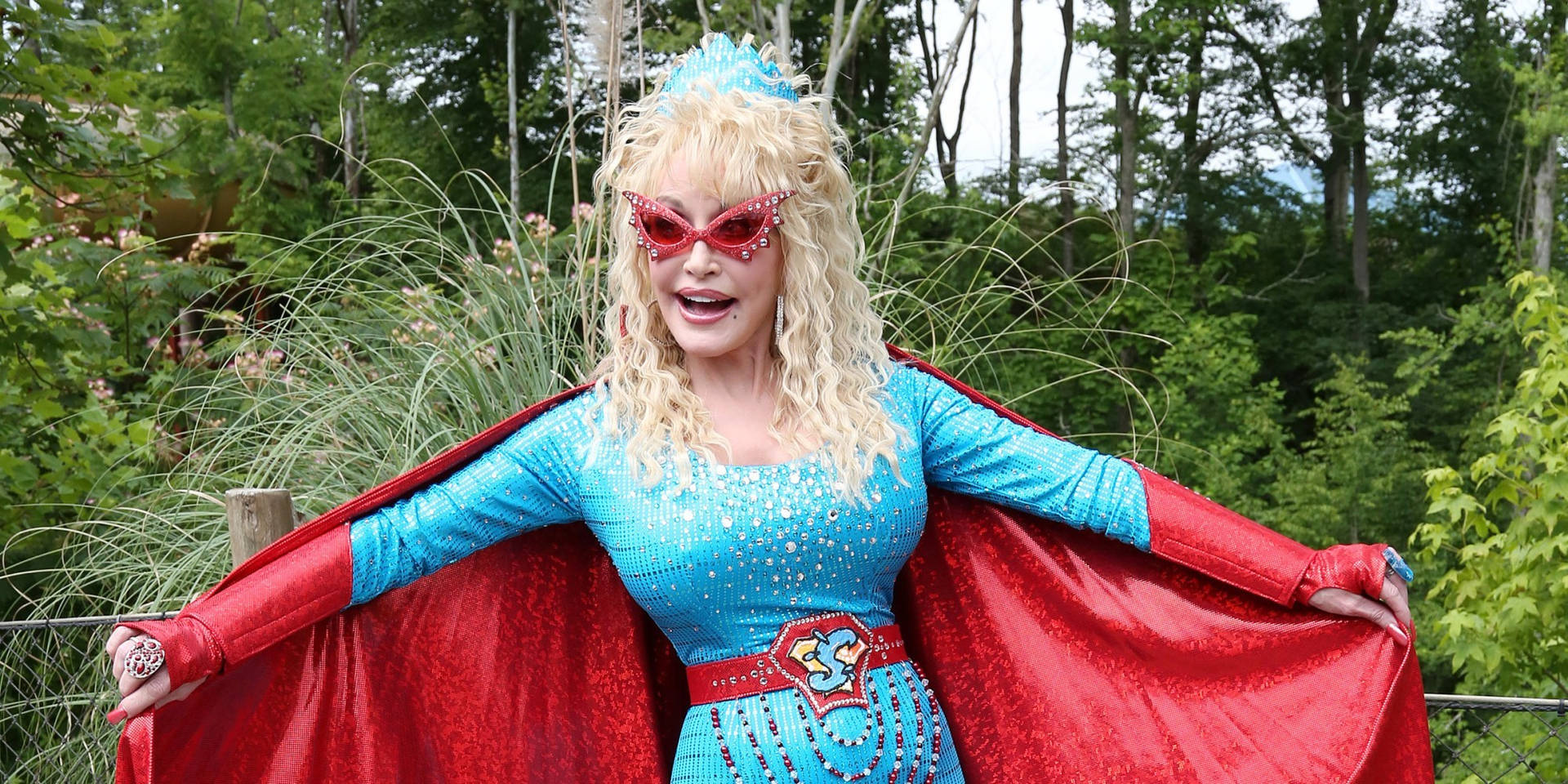 Dolly Parton In Superhero Costume Background