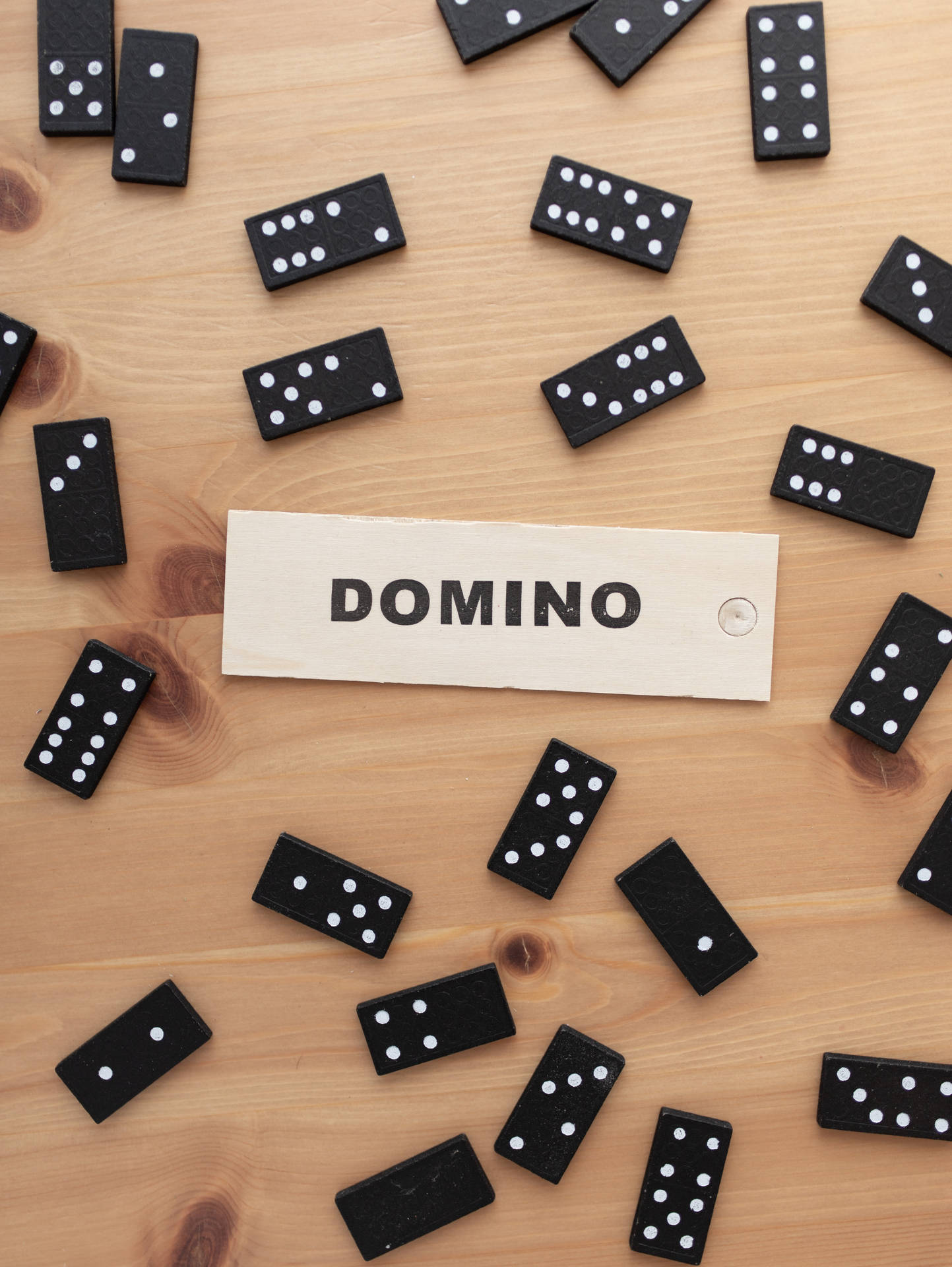 Dominos Scattered On Table Background
