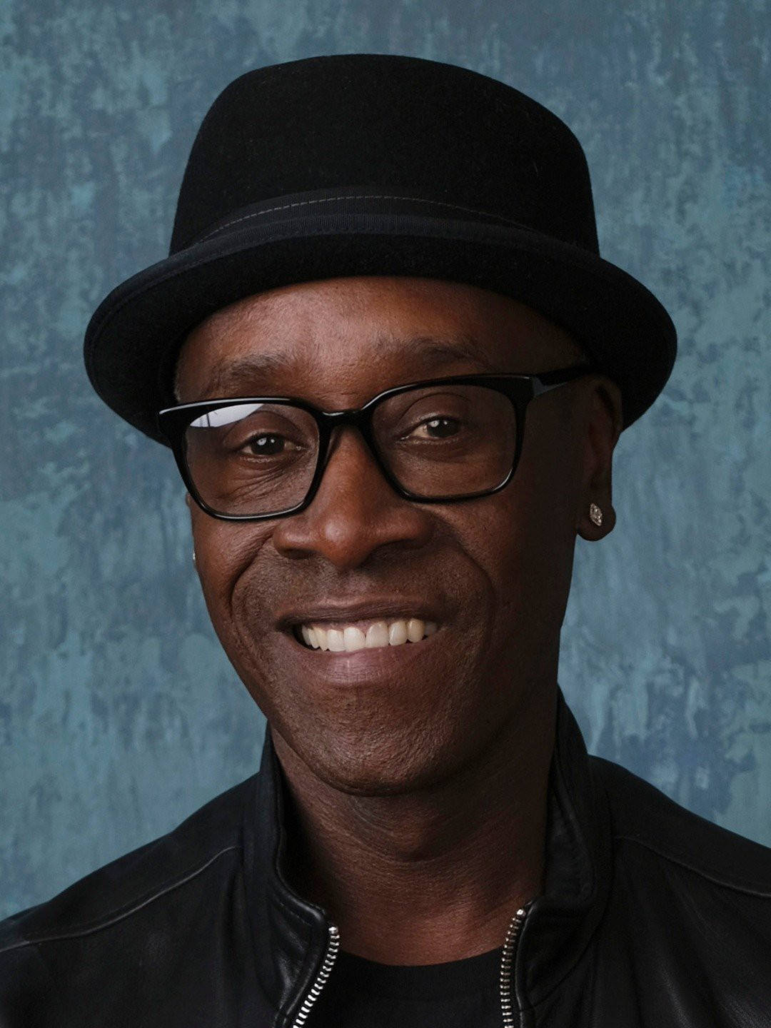 Don Cheadle Displaying Cool Confidence In A Stylish Hat Background