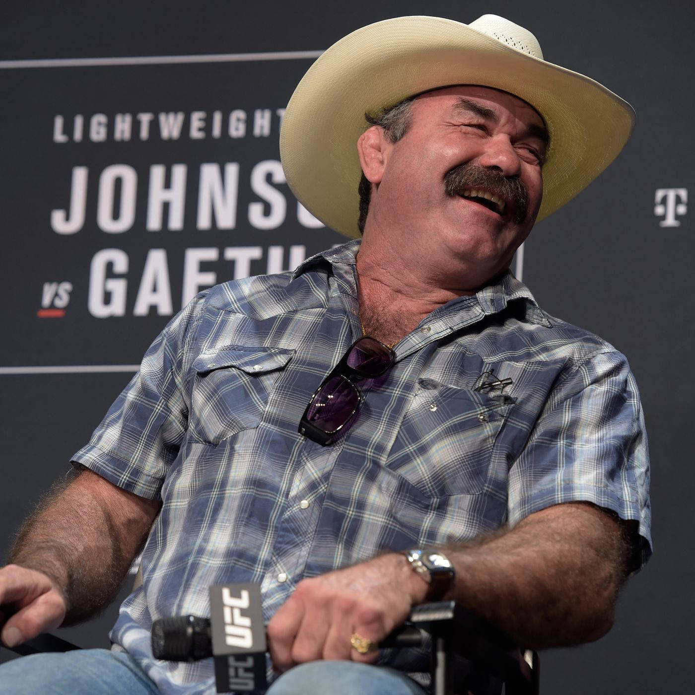 Don Frye Chuckling At A Conference Background