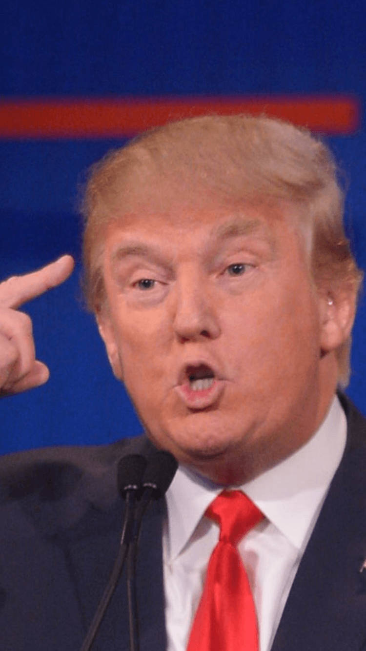 Donald Trump Pointing To His Head Background