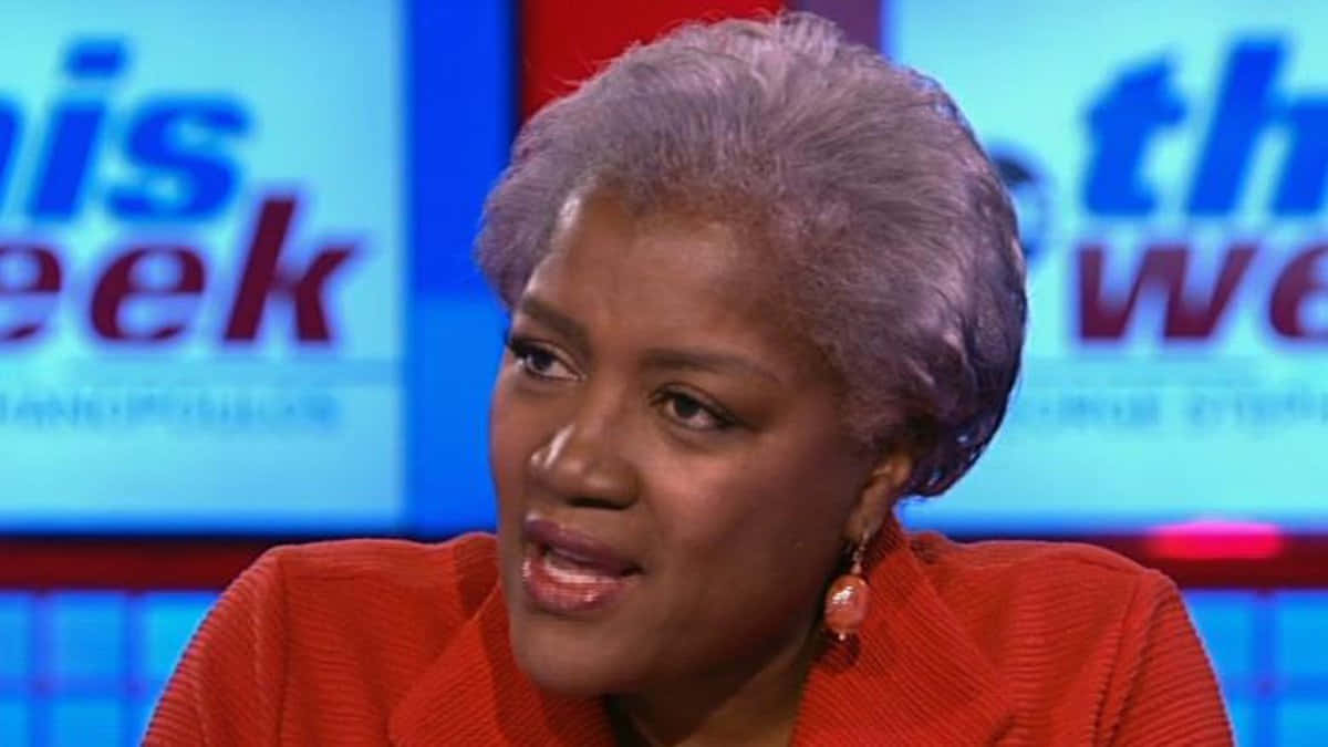 Donna Brazile Delivering A Keynote Speech Background