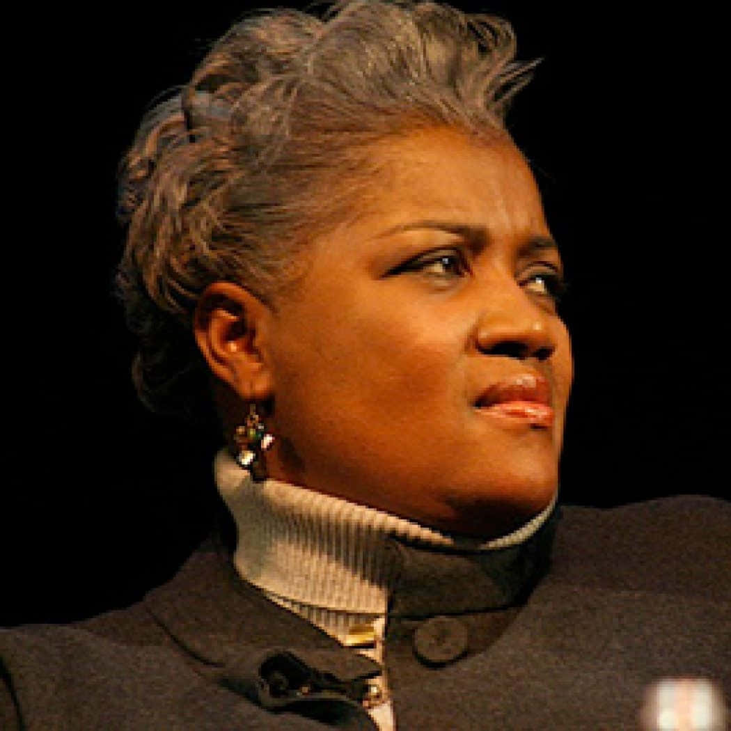 Donna Brazile Delivering A Speech At A Public Event Background
